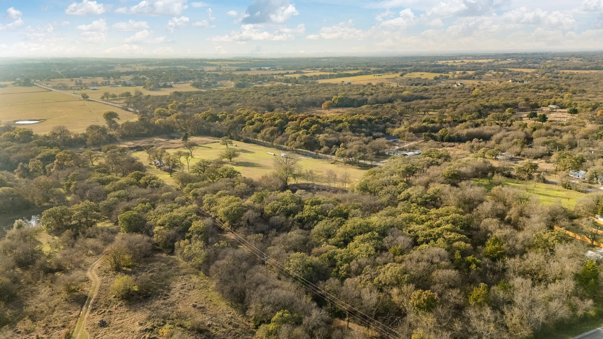 Aerial view of property and surrounding area featuring rural landscape