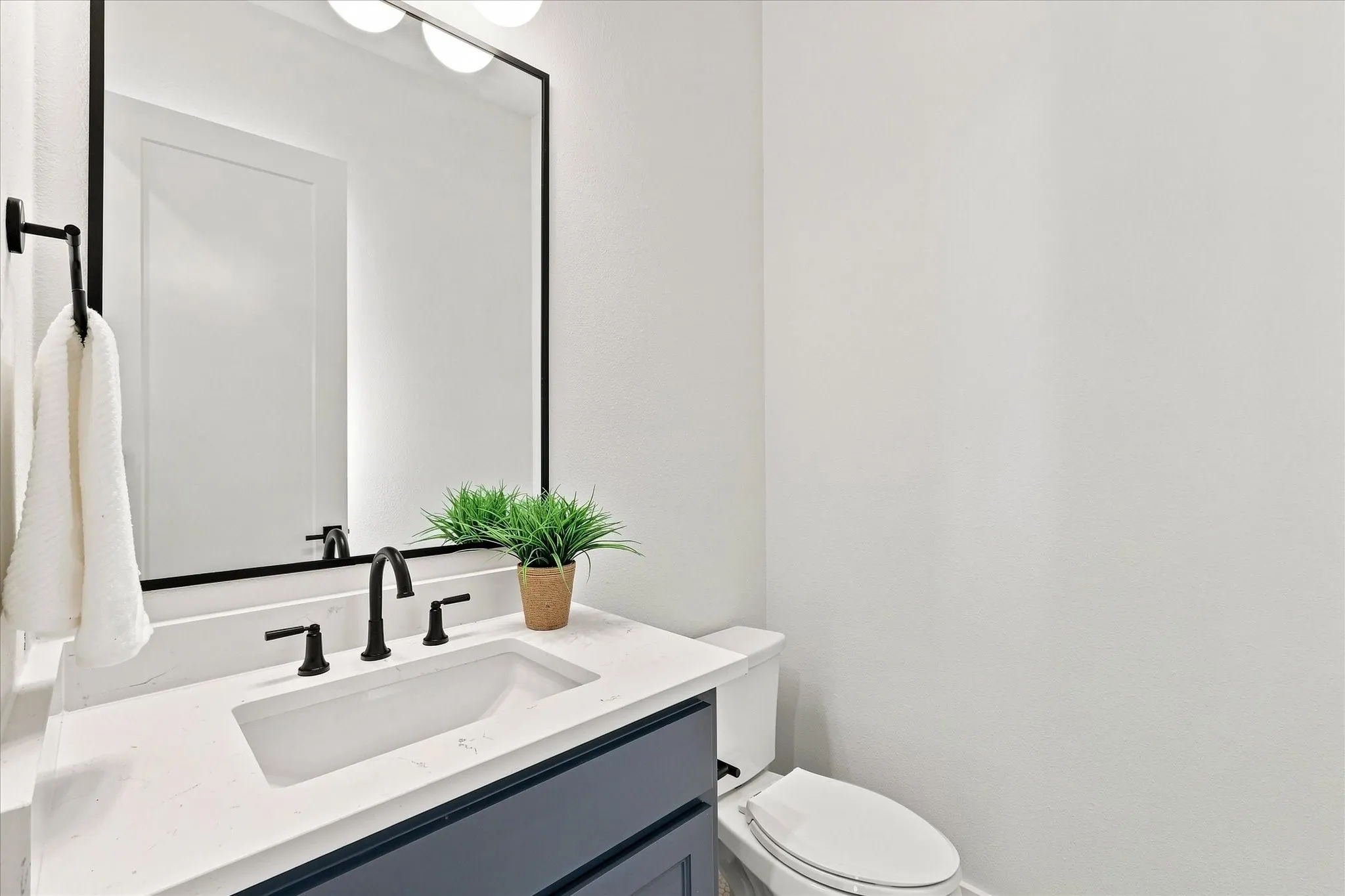 1/2 bath for guests at the front of the home.
