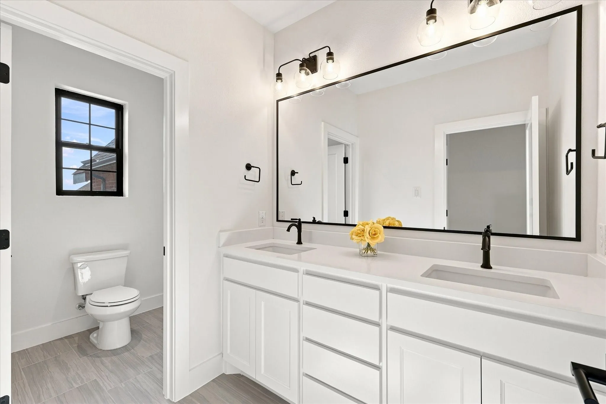 Nice large bathroom upstairs with dual sinks and privacy from shower.