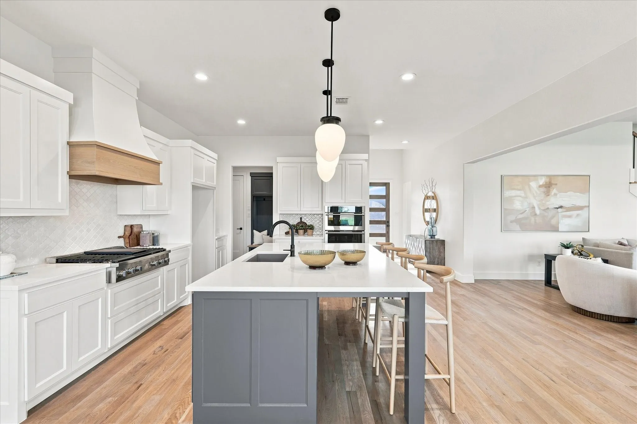 The island provides lots of space for family to pull up and eat or do homework, meal prep etc.