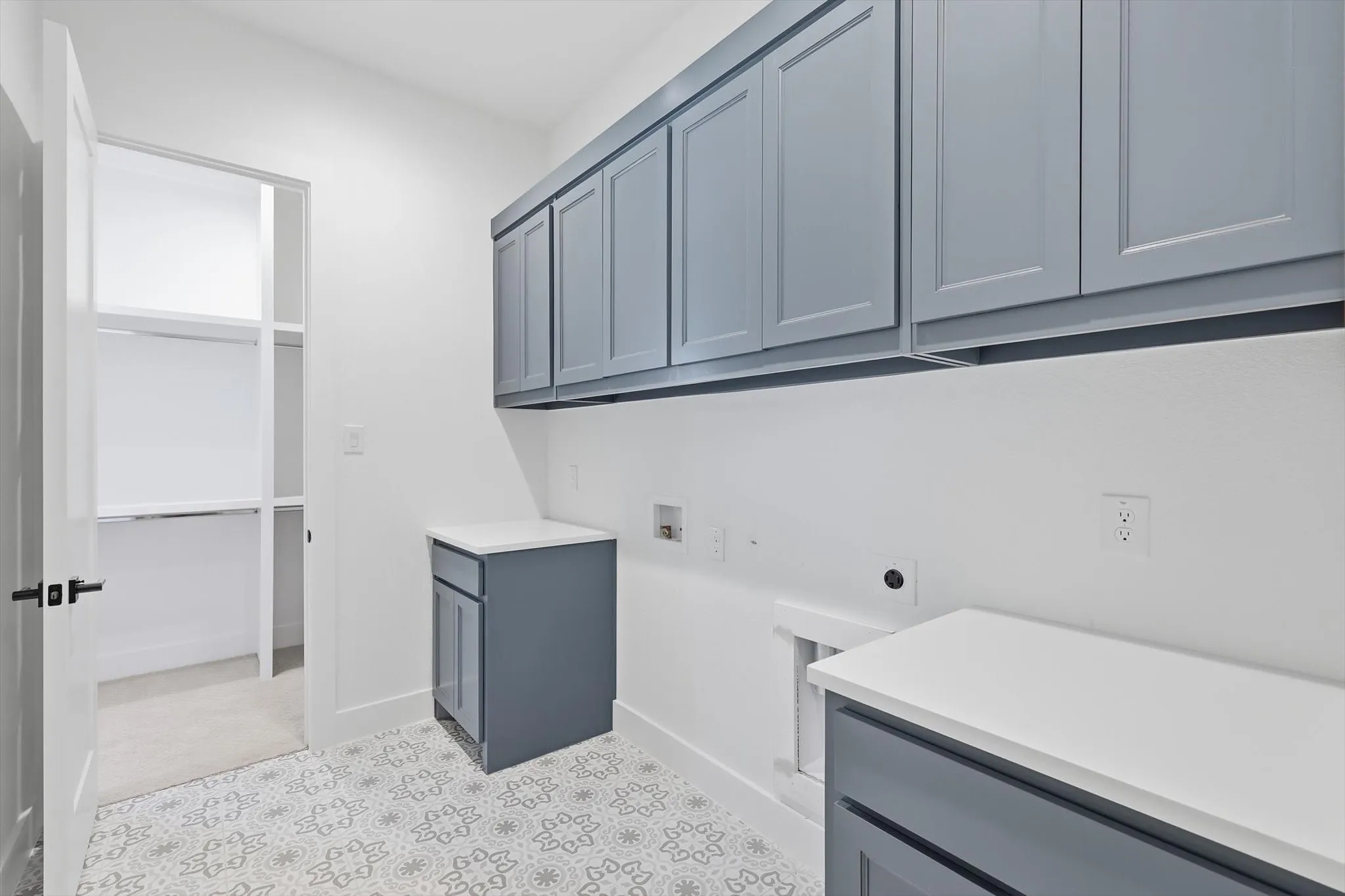 Laundry room that connects to the master closet! Everyone loves not having to haul their clothes across the house.