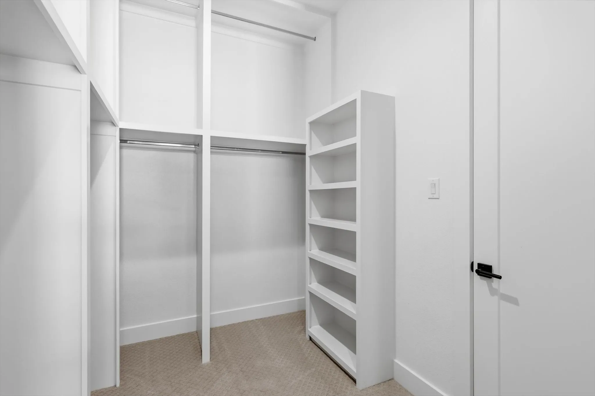 This closet was hard to capture--- lots more space than this!  Built ins for shoes and bags, seasonal clothes.