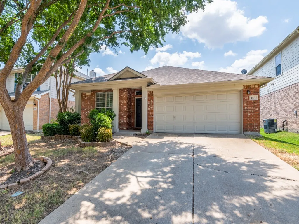 Covered front porch and a two car garage.