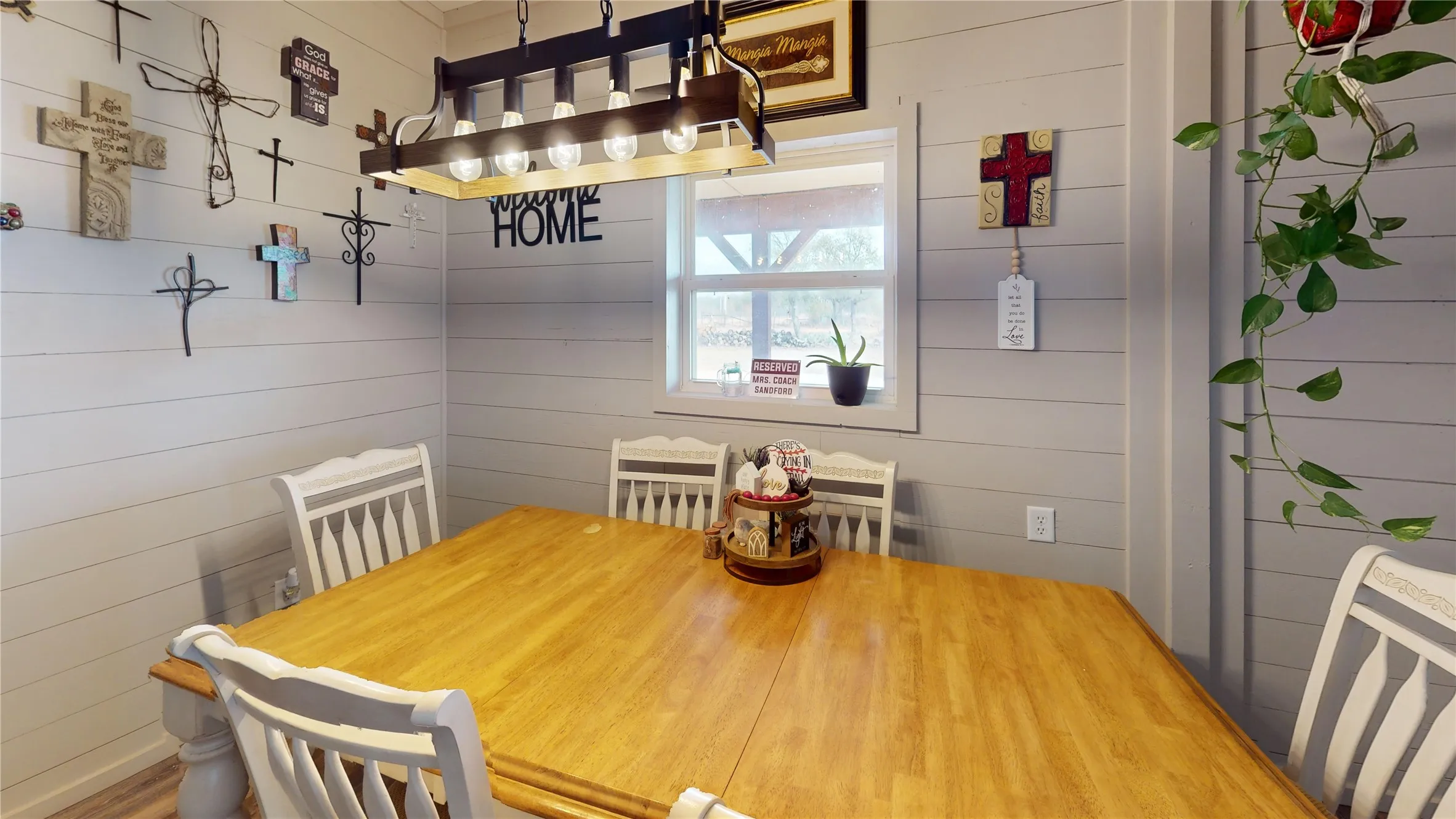 Dining space featuring wood walls