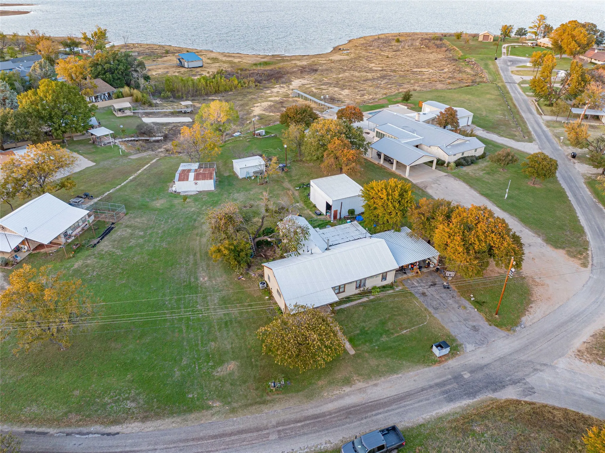 View of property location with a nearby body of water and nearby suburban area