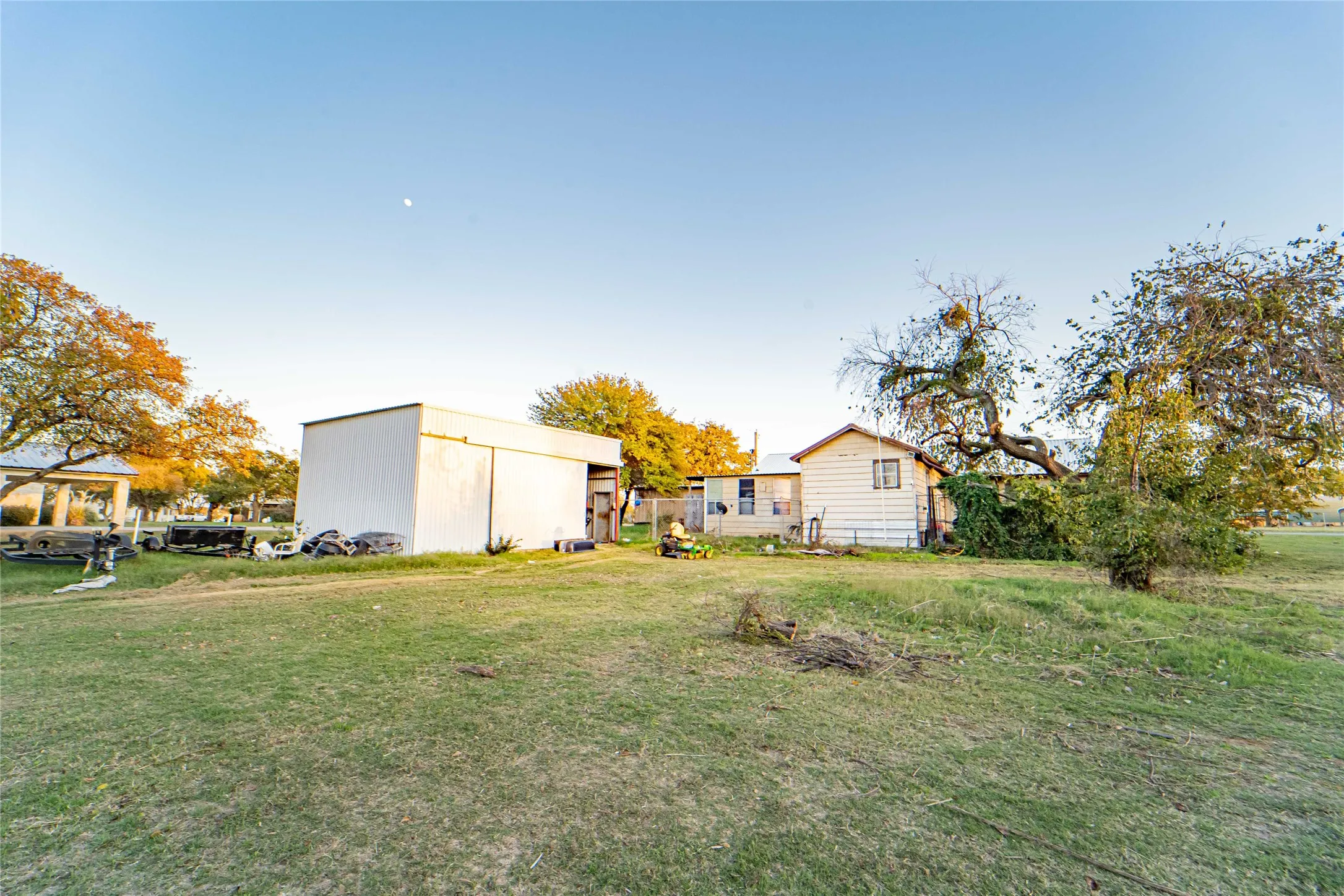 View of grassy yard with an outdoor structure