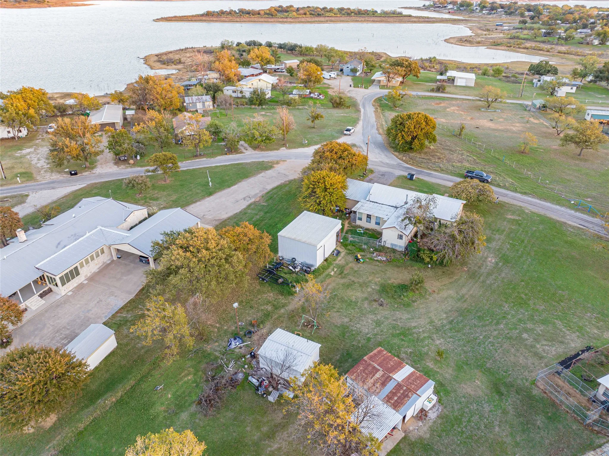 View of property location with a large body of water and nearby suburban area