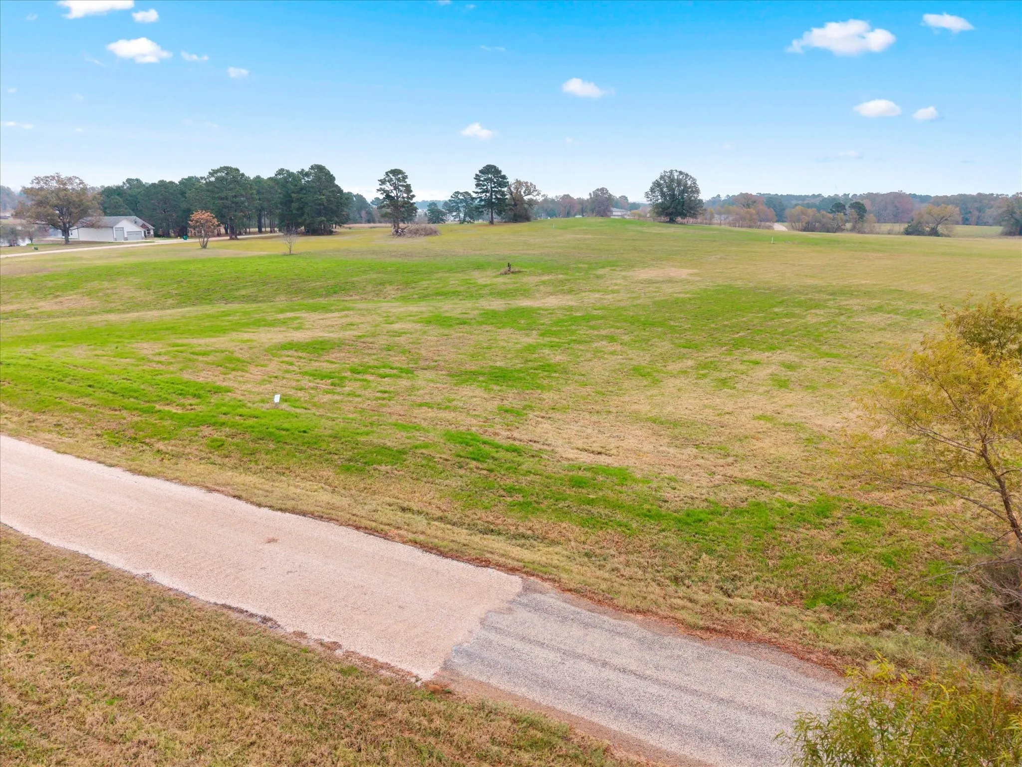 Surrounding community with a rural view and a yard