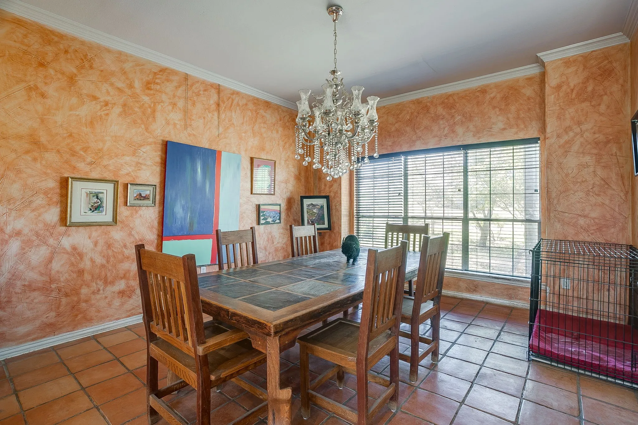 Large dining room with natural light and chandelier