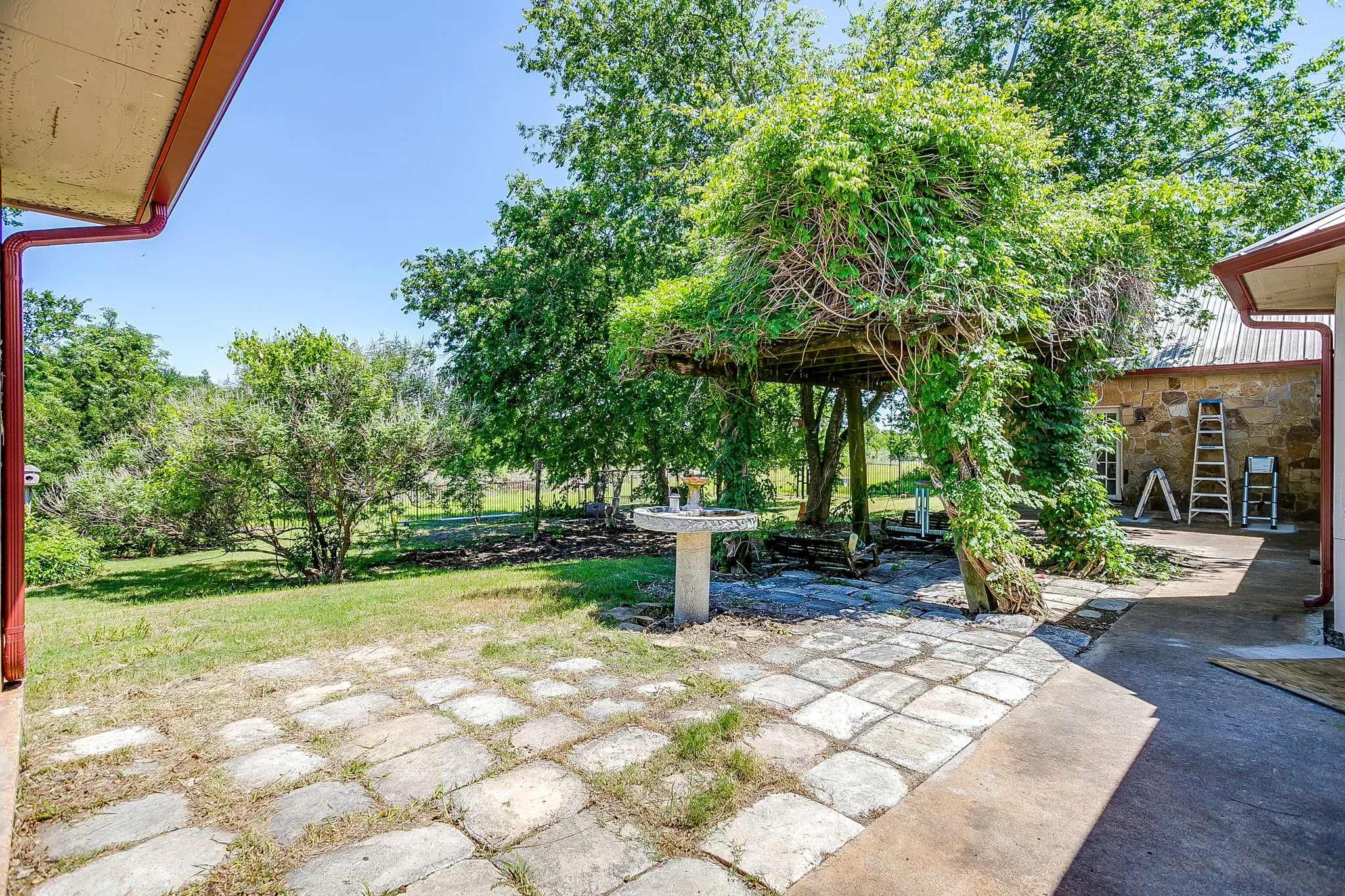 Backyard with pavers and lots of nature