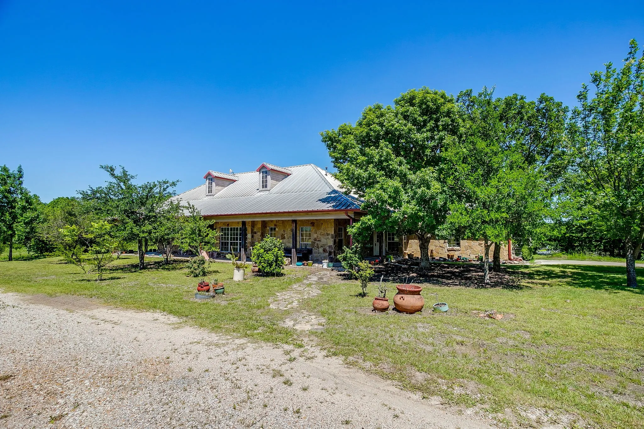 House was built in 1995 using hand-laid Oklahoma quarry stone and a metal roof