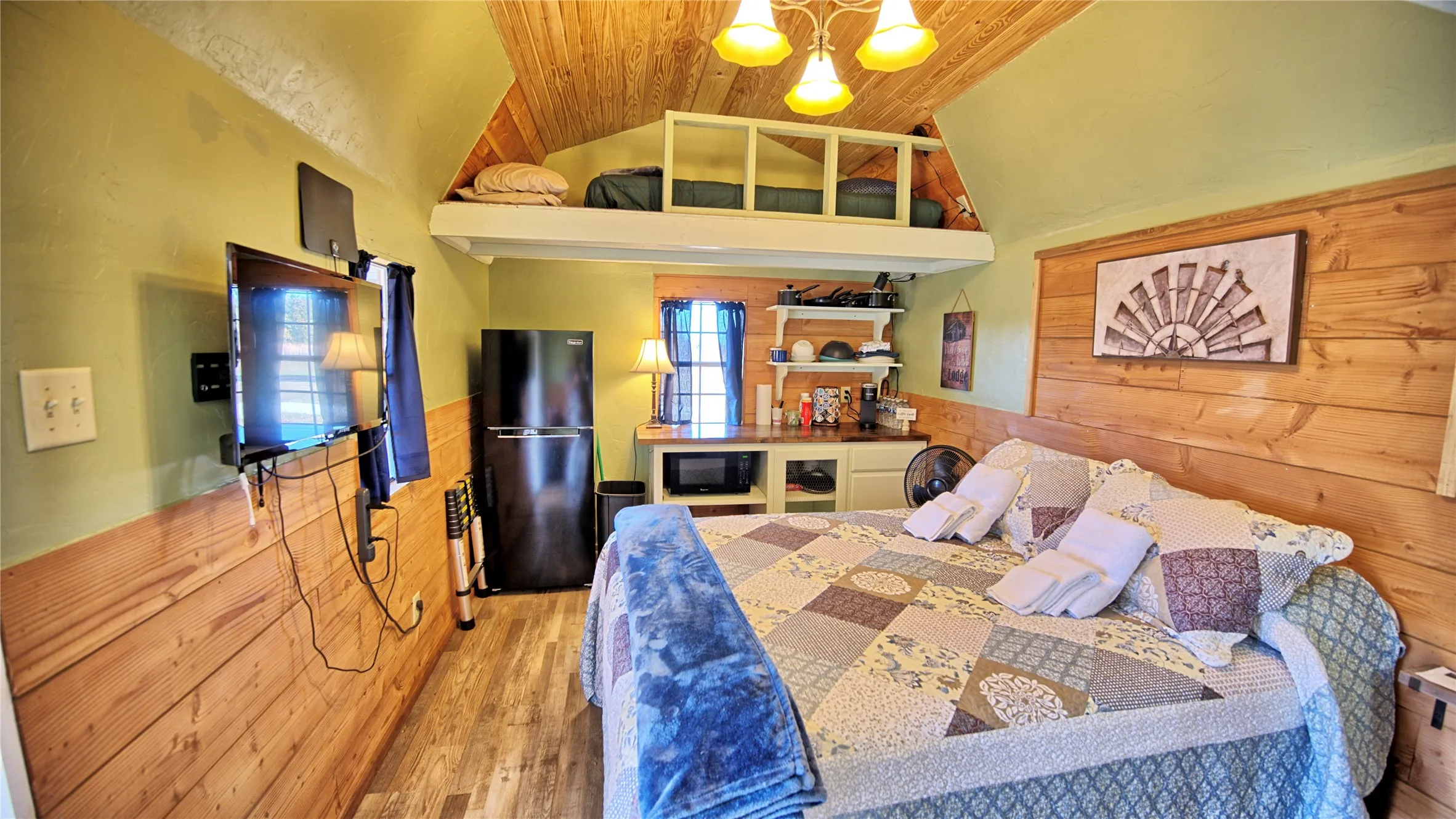 Inside of Margaret's Nest featuring Queen Bed, refrigerator and Loft area