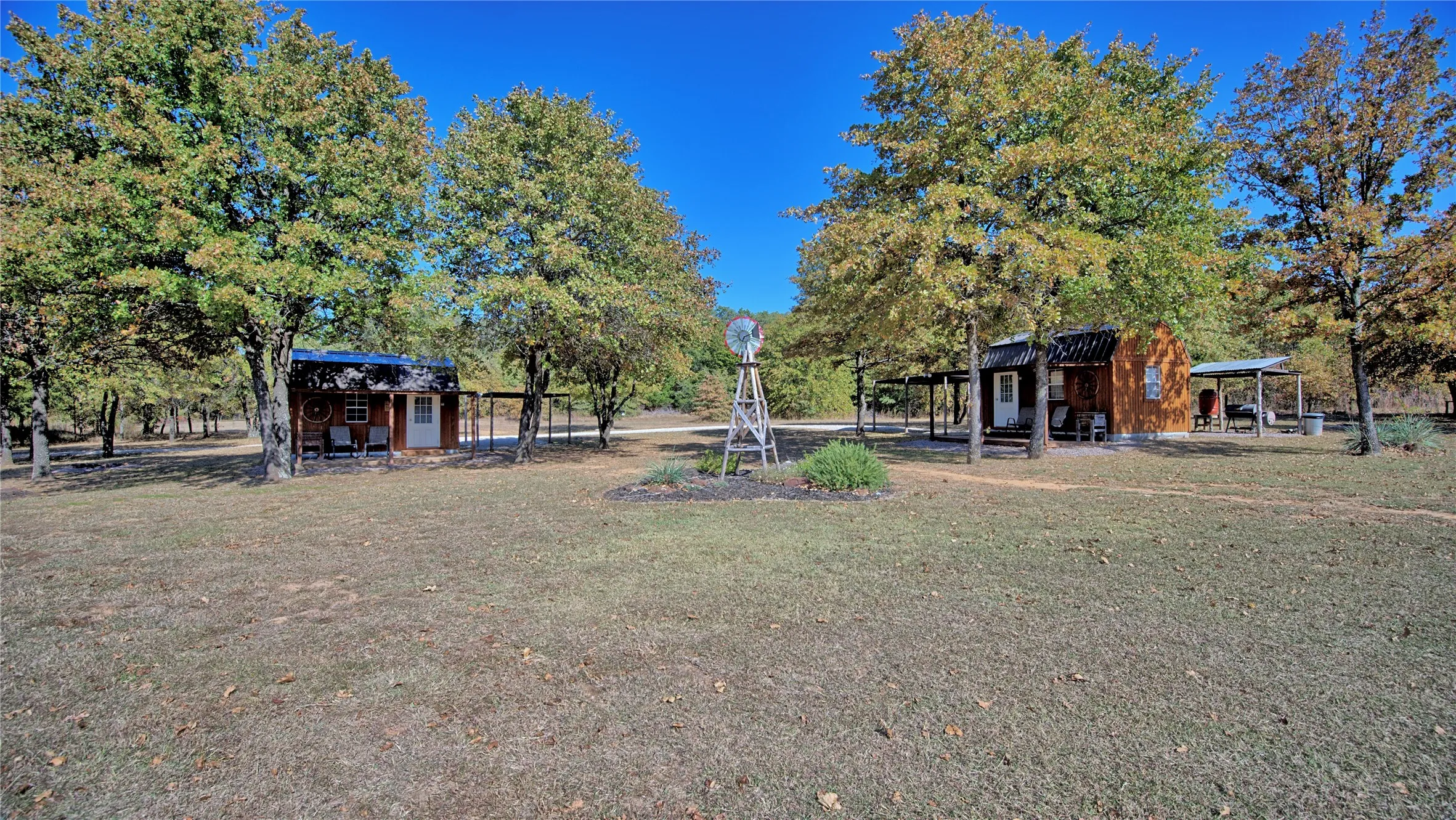 Two, Tiny Cabins with individual carports and grilling stations