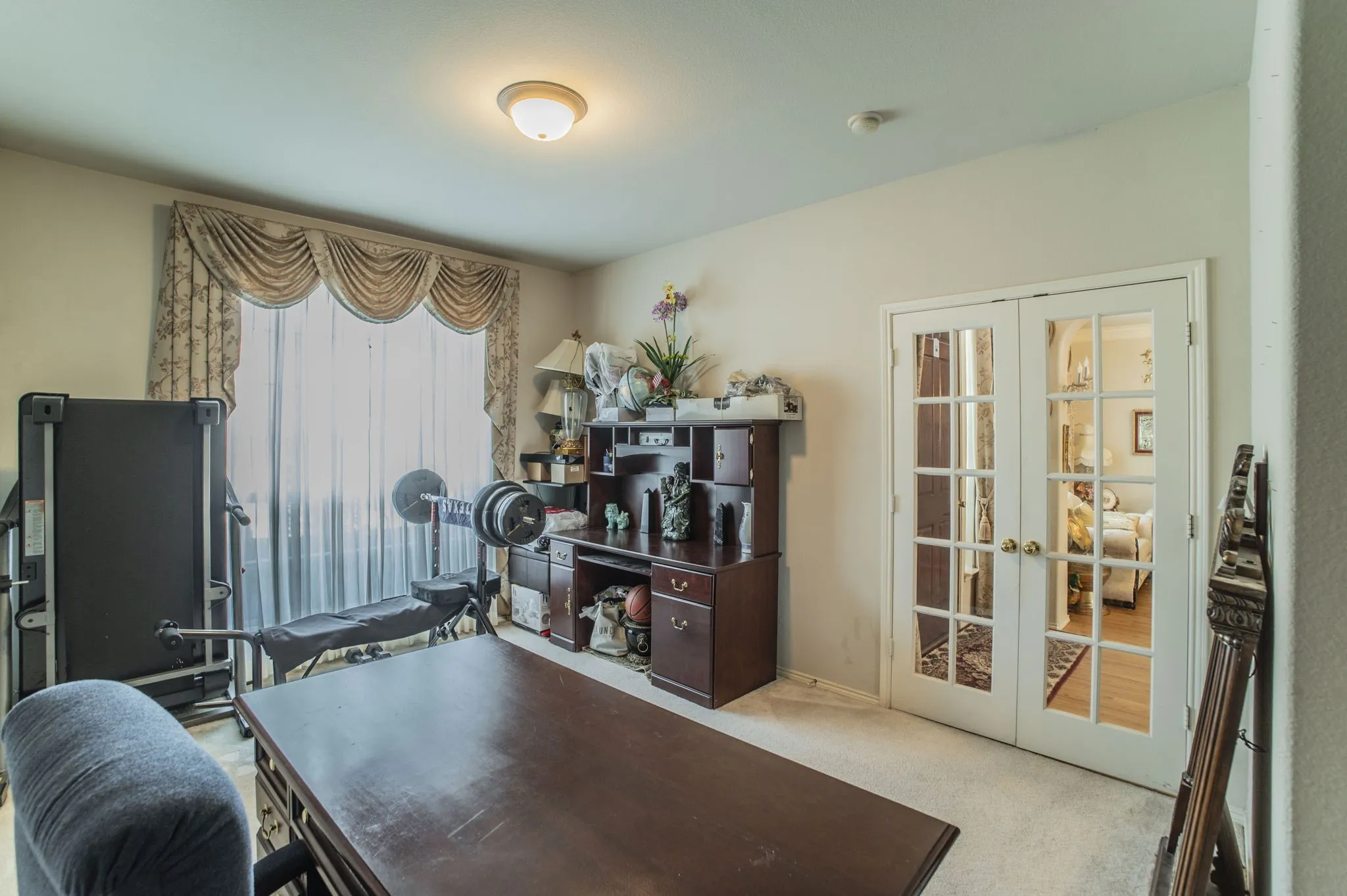 Home office with french doors and carpet