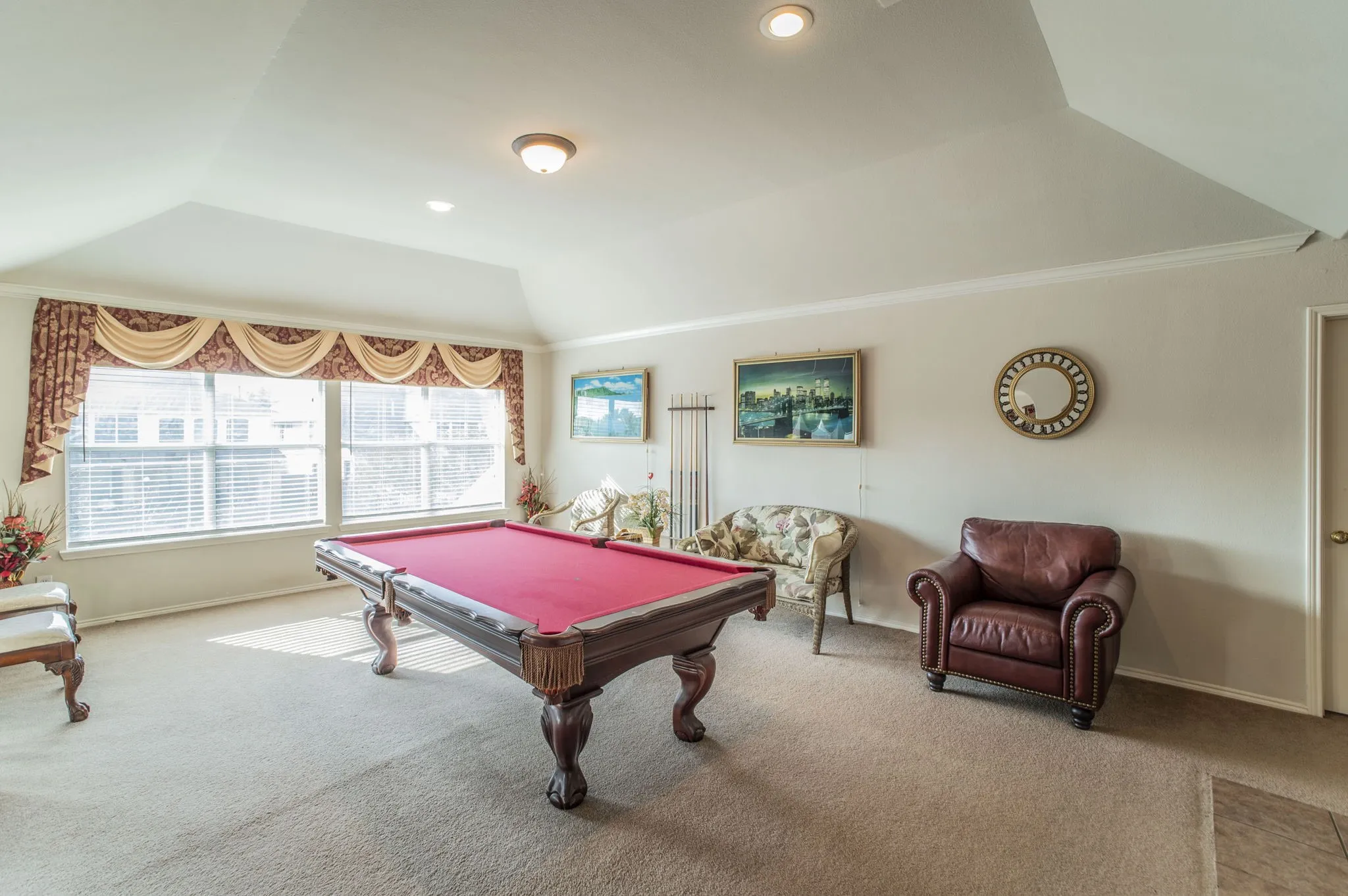 Playroom with billiards, carpet floors, ornamental molding, and lofted ceiling