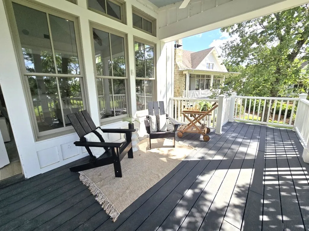 walk out onto the covered porch to enjoy the views of the lake