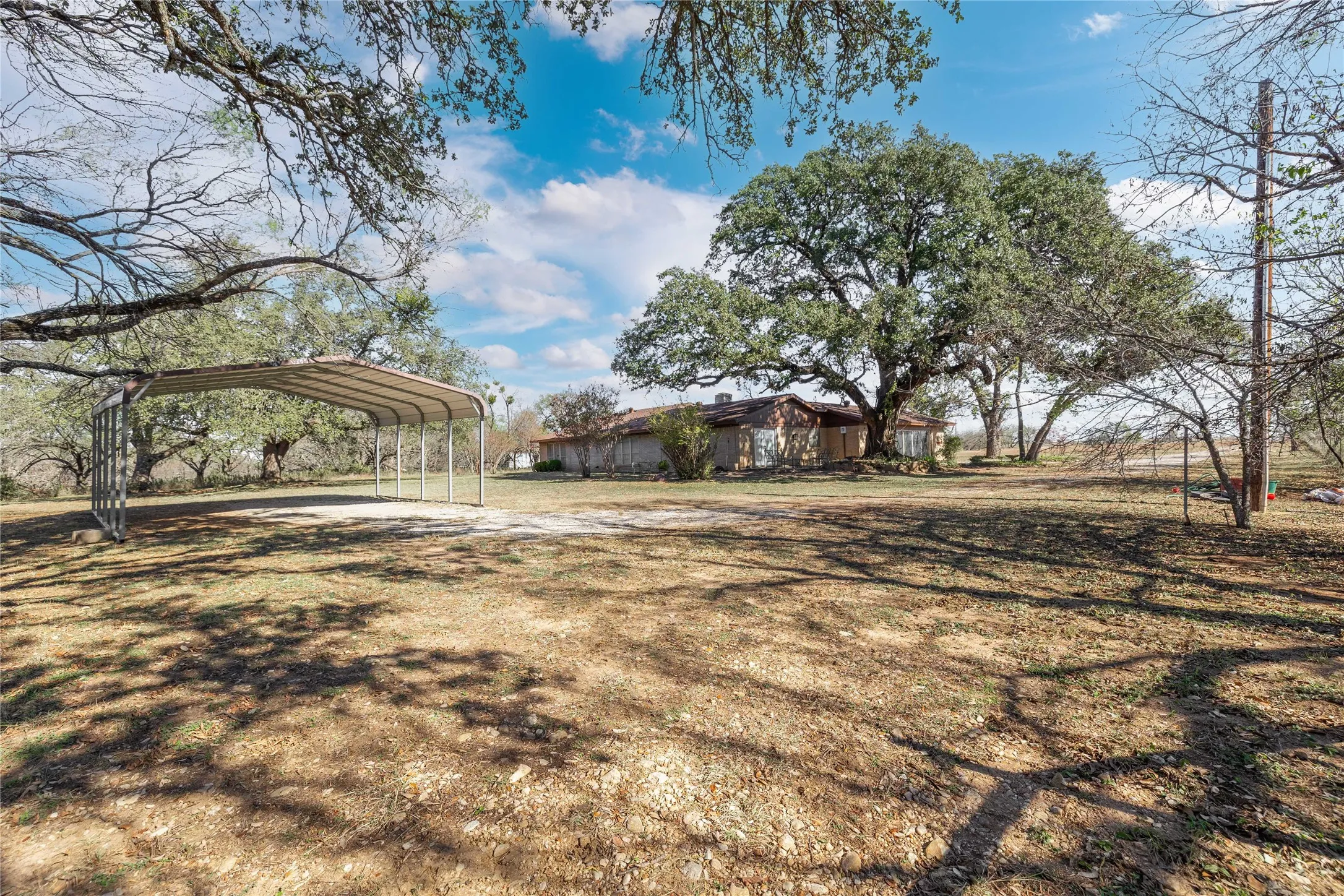 Yard with detached carport