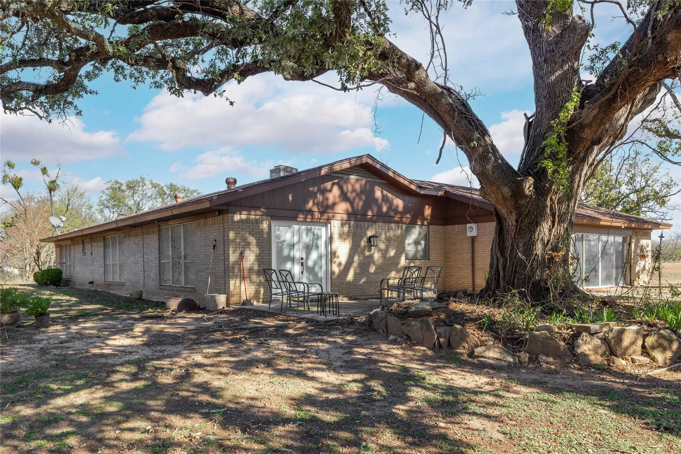 Back side of house with side patio