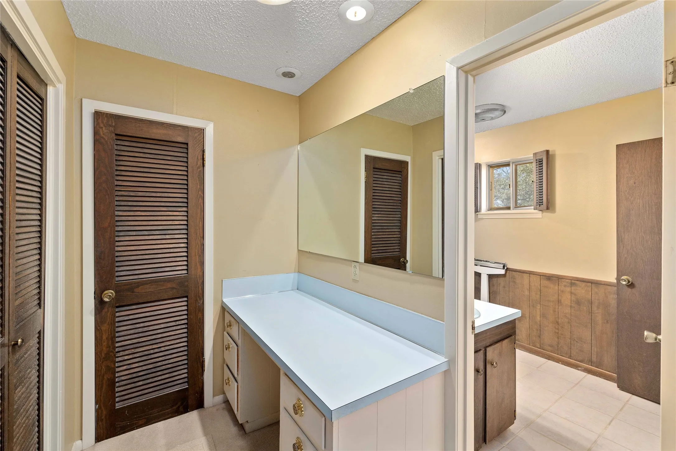 Unique primary bathroom with split design
