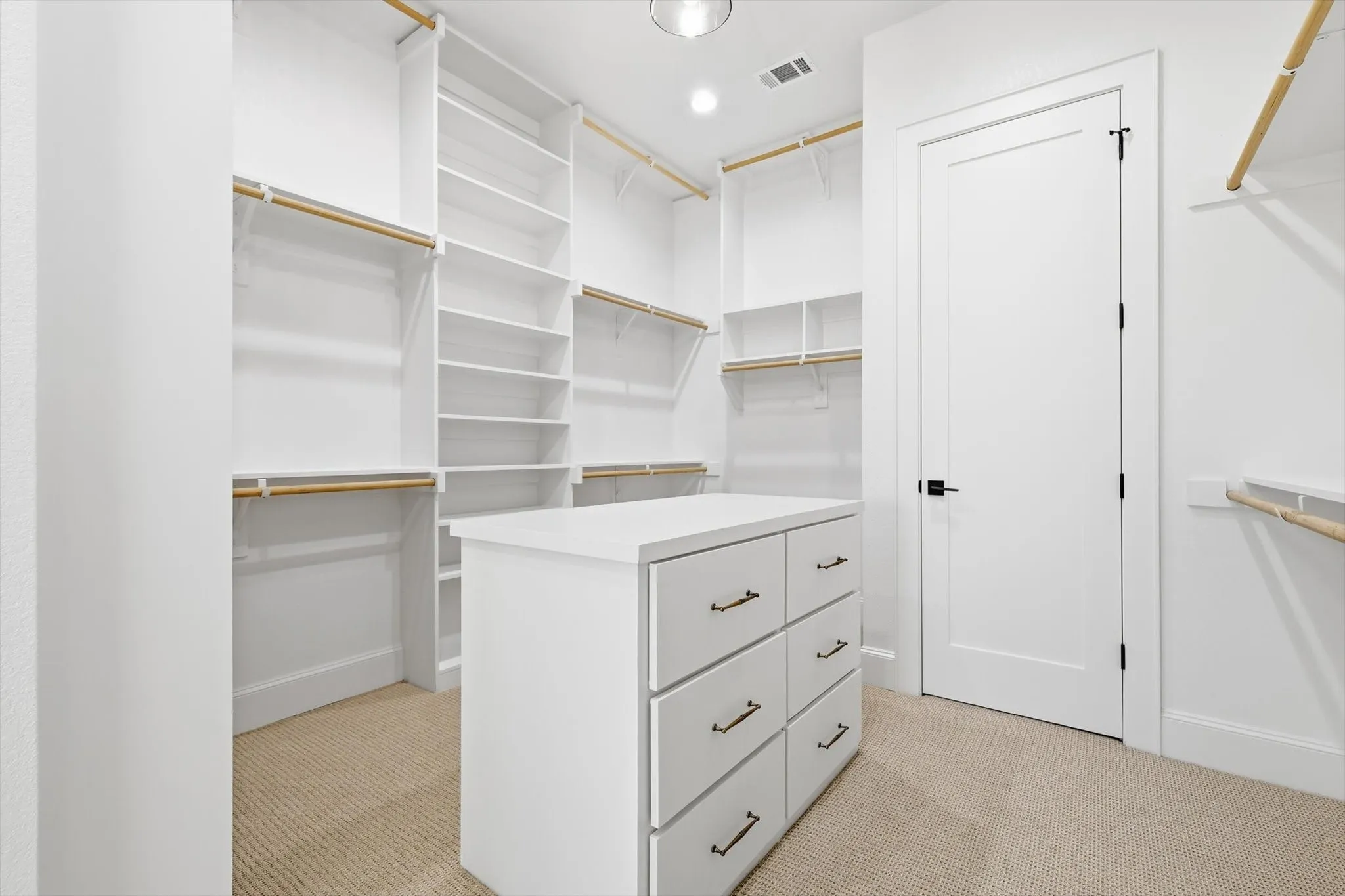 Large Primary Closet with 3 rows of racks.