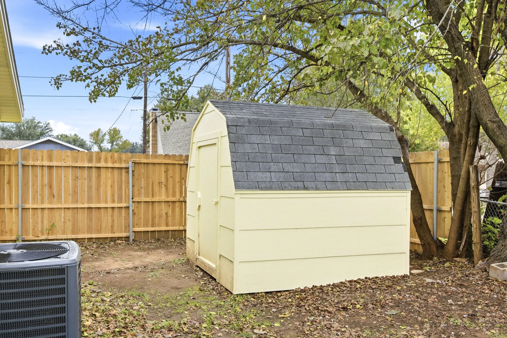 View of shed featuring a fenced backyard