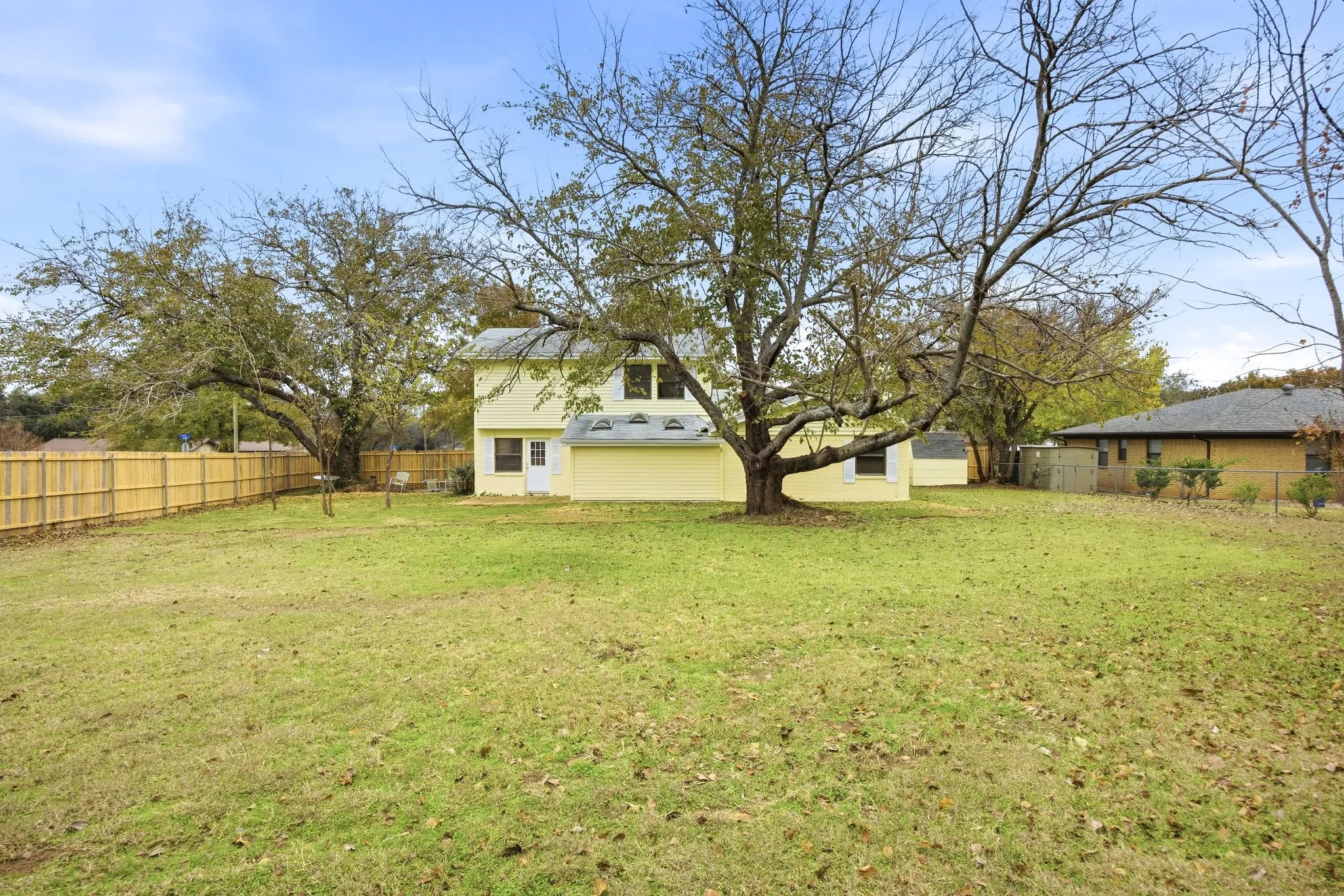 View of fenced backyard