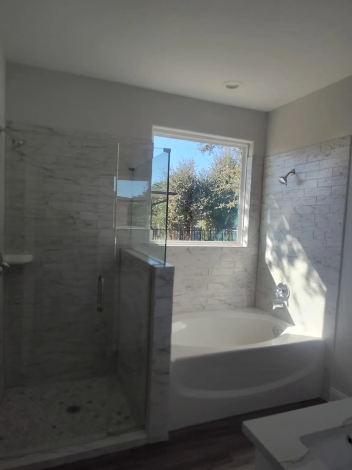 Full bath featuring a shower stall, a bath, and vanity