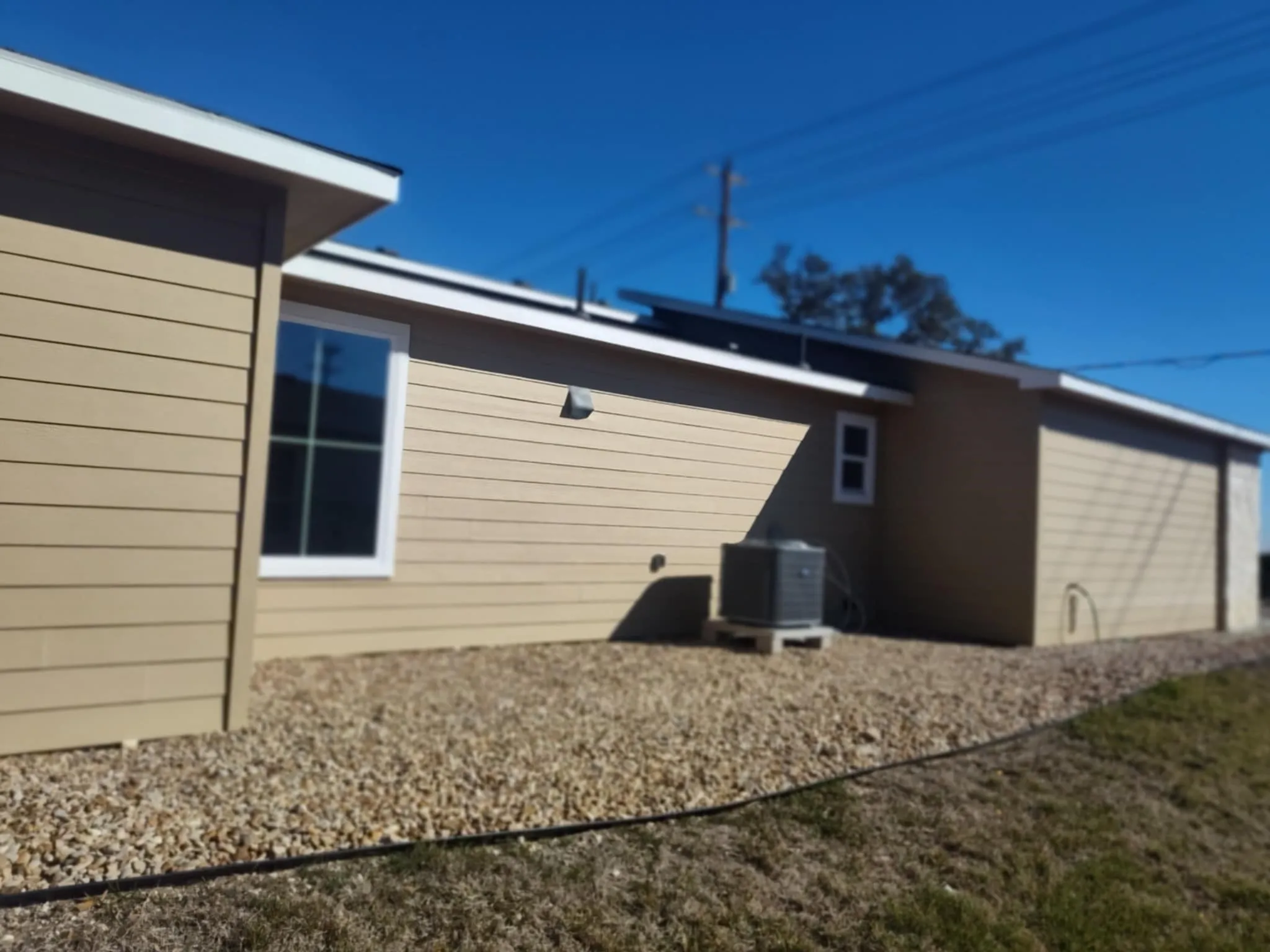 View of property exterior with a cooling unit