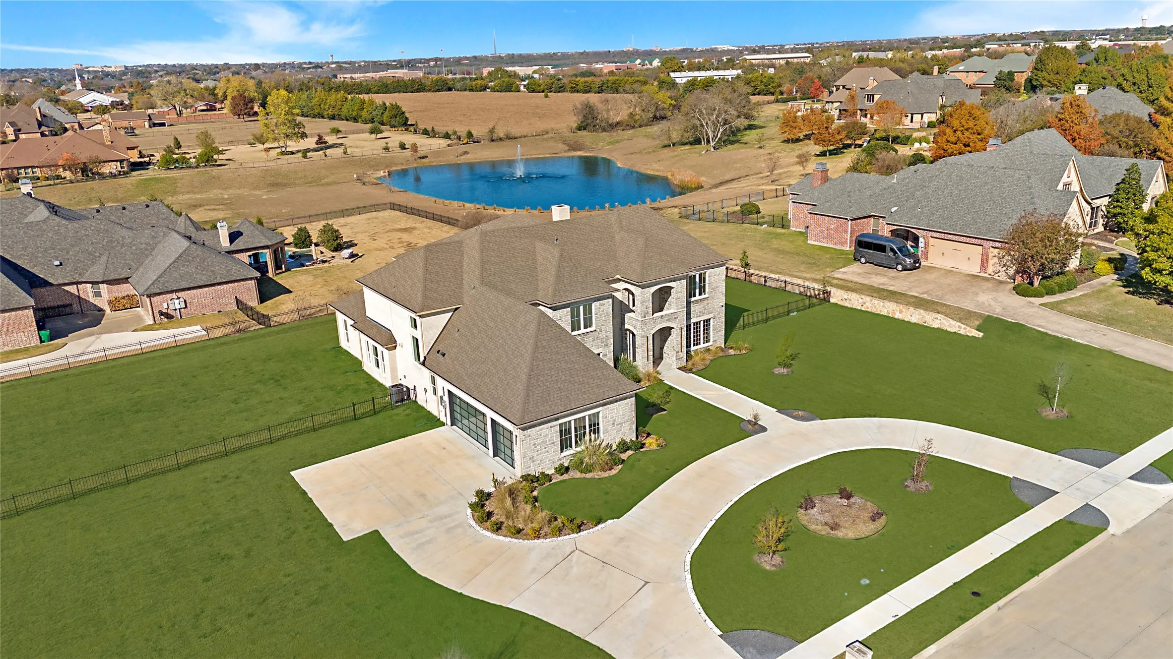 Aerial perspective of suburban area with a nearby body of water