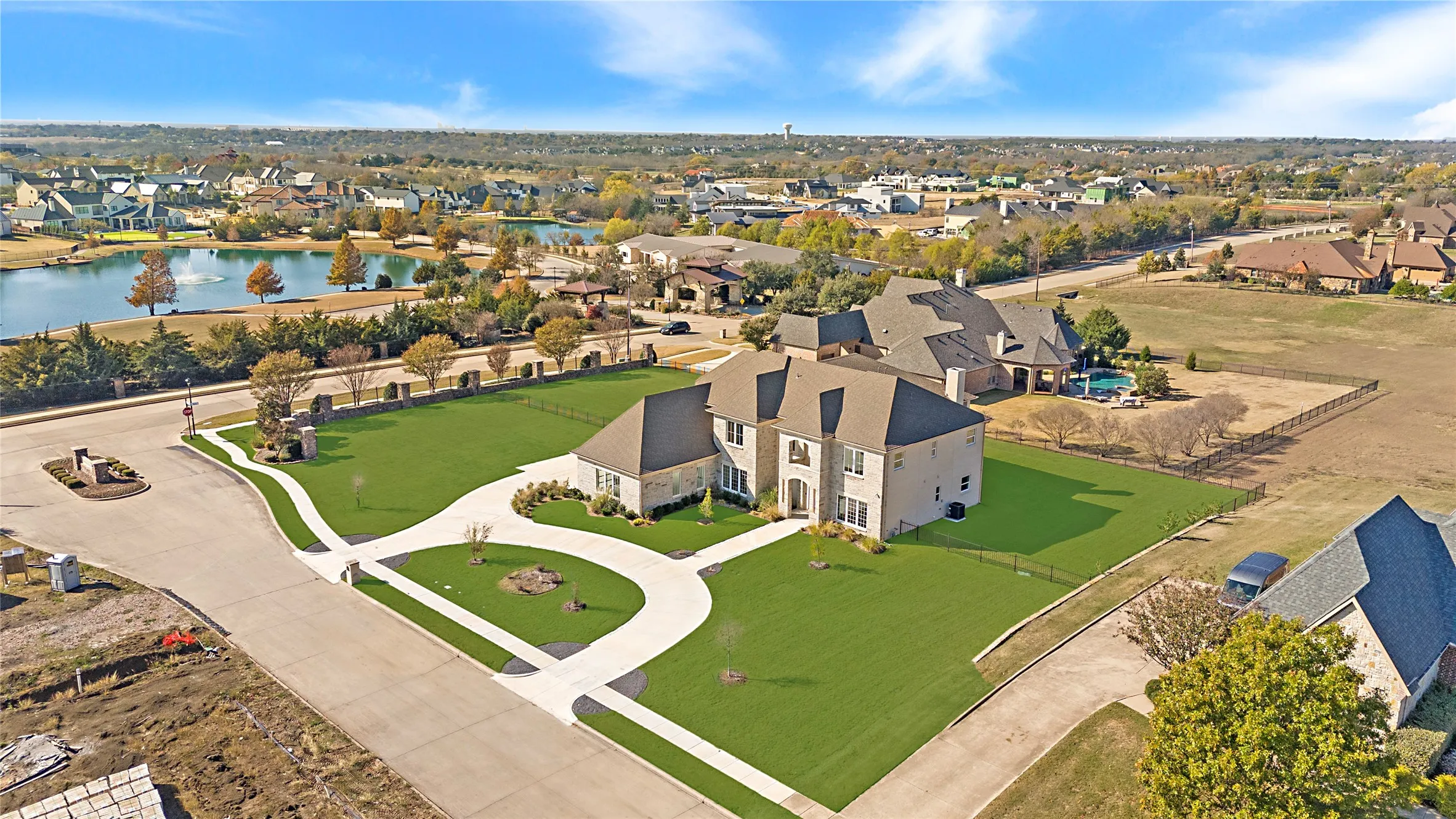 Aerial perspective of suburban area with a large body of water