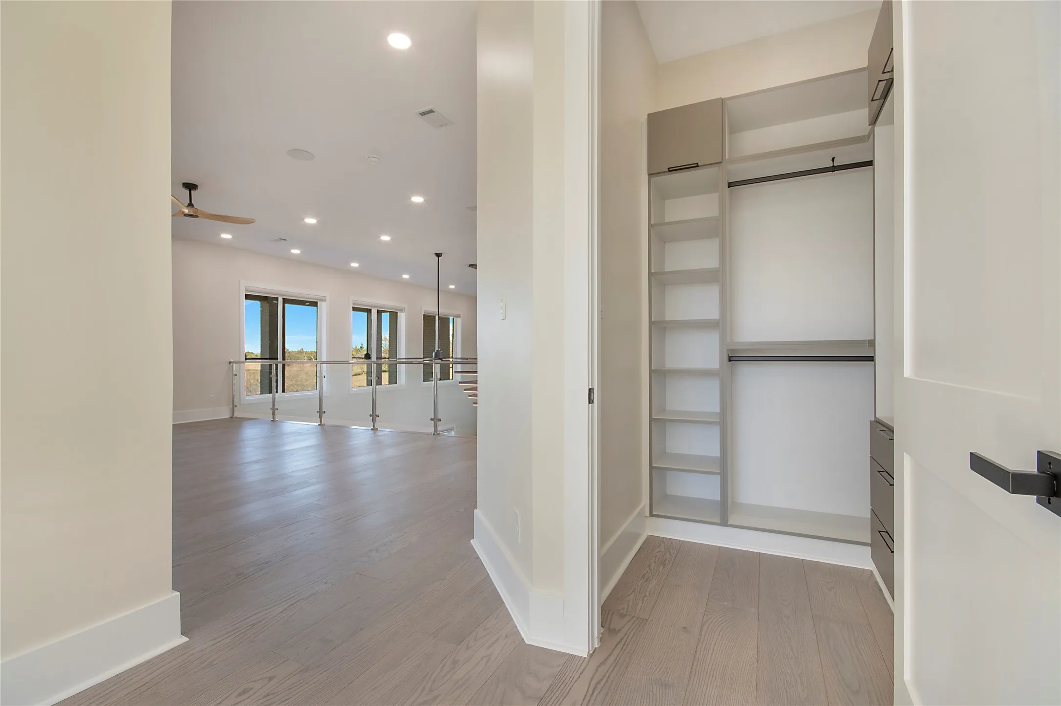 Corridor featuring recessed lighting and light wood-style flooring