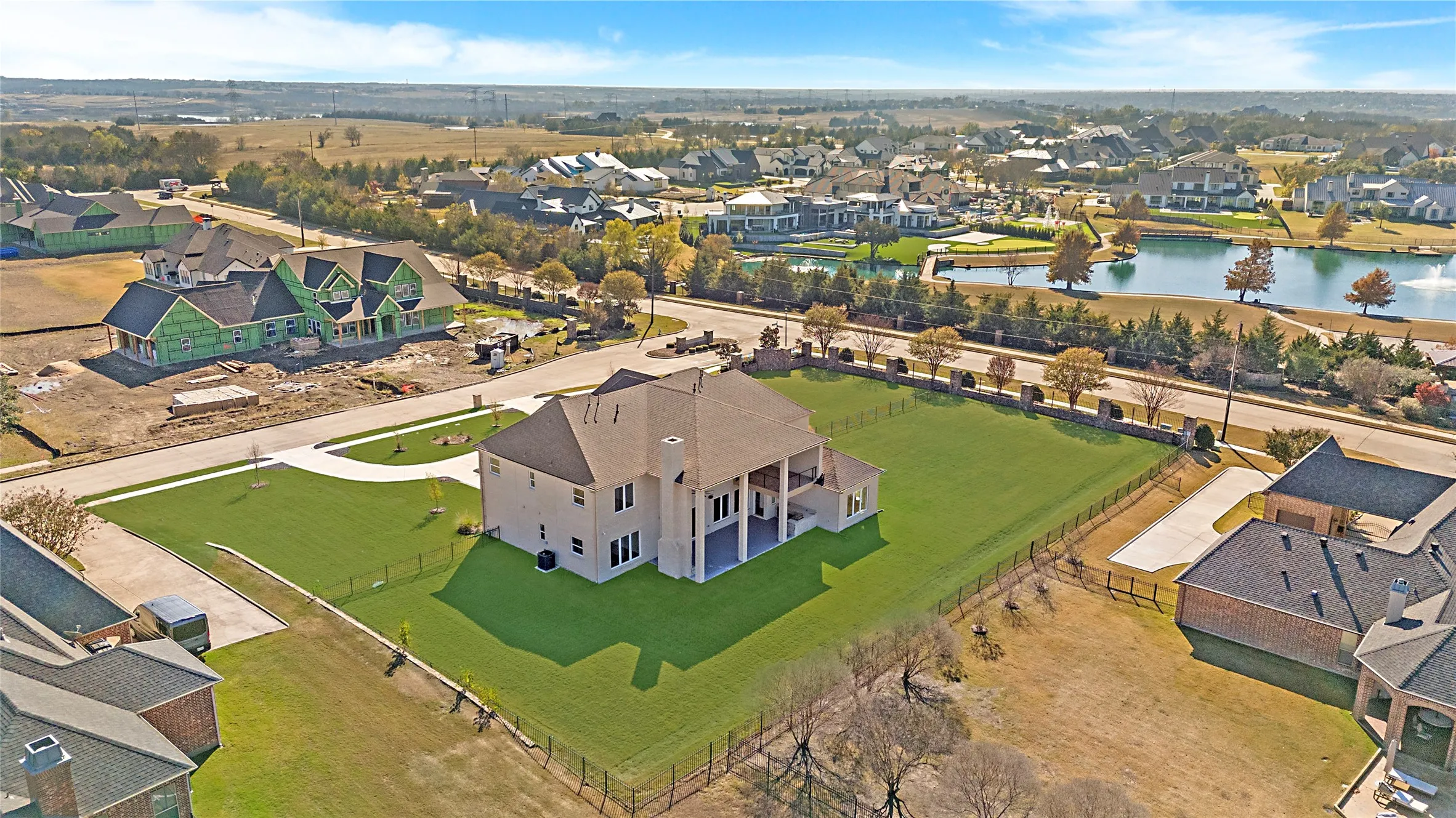 Aerial perspective of suburban area with a large body of water