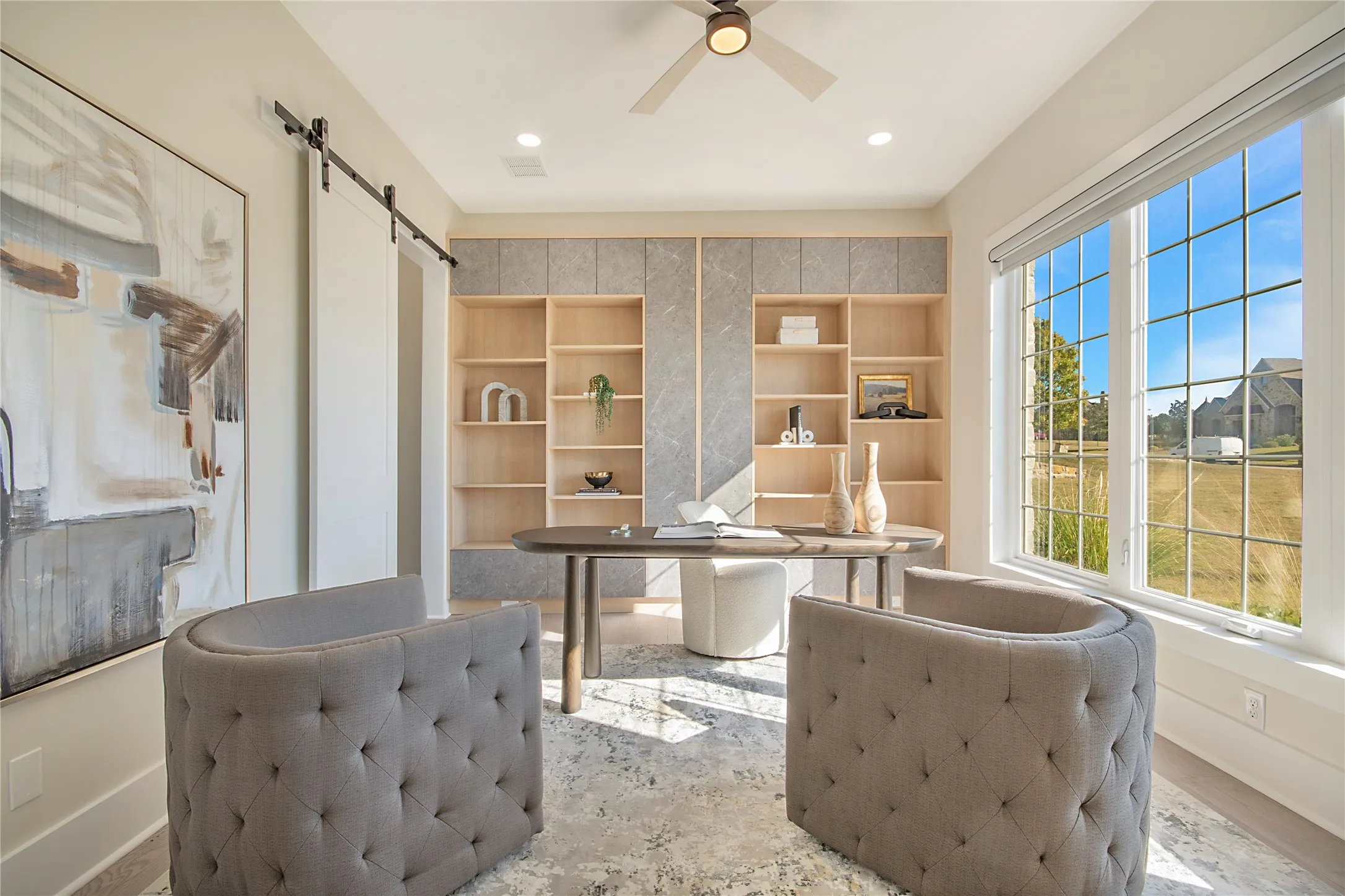 Office area with a barn door, ceiling fan, and recessed lighting