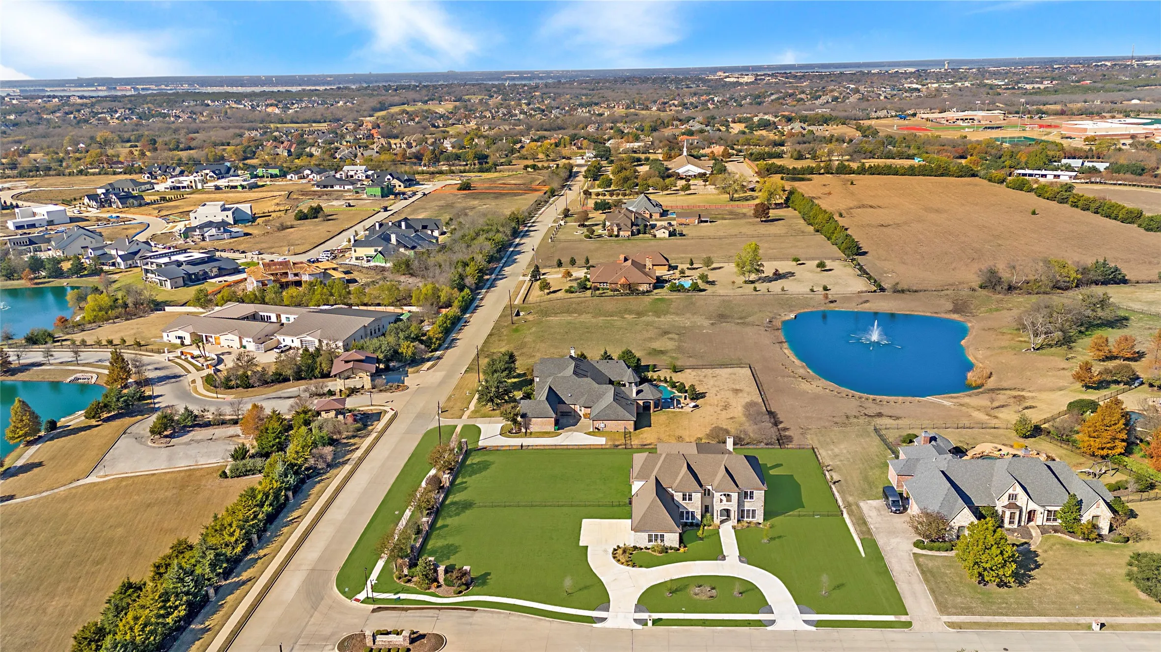 View of property location with a nearby body of water and nearby suburban area