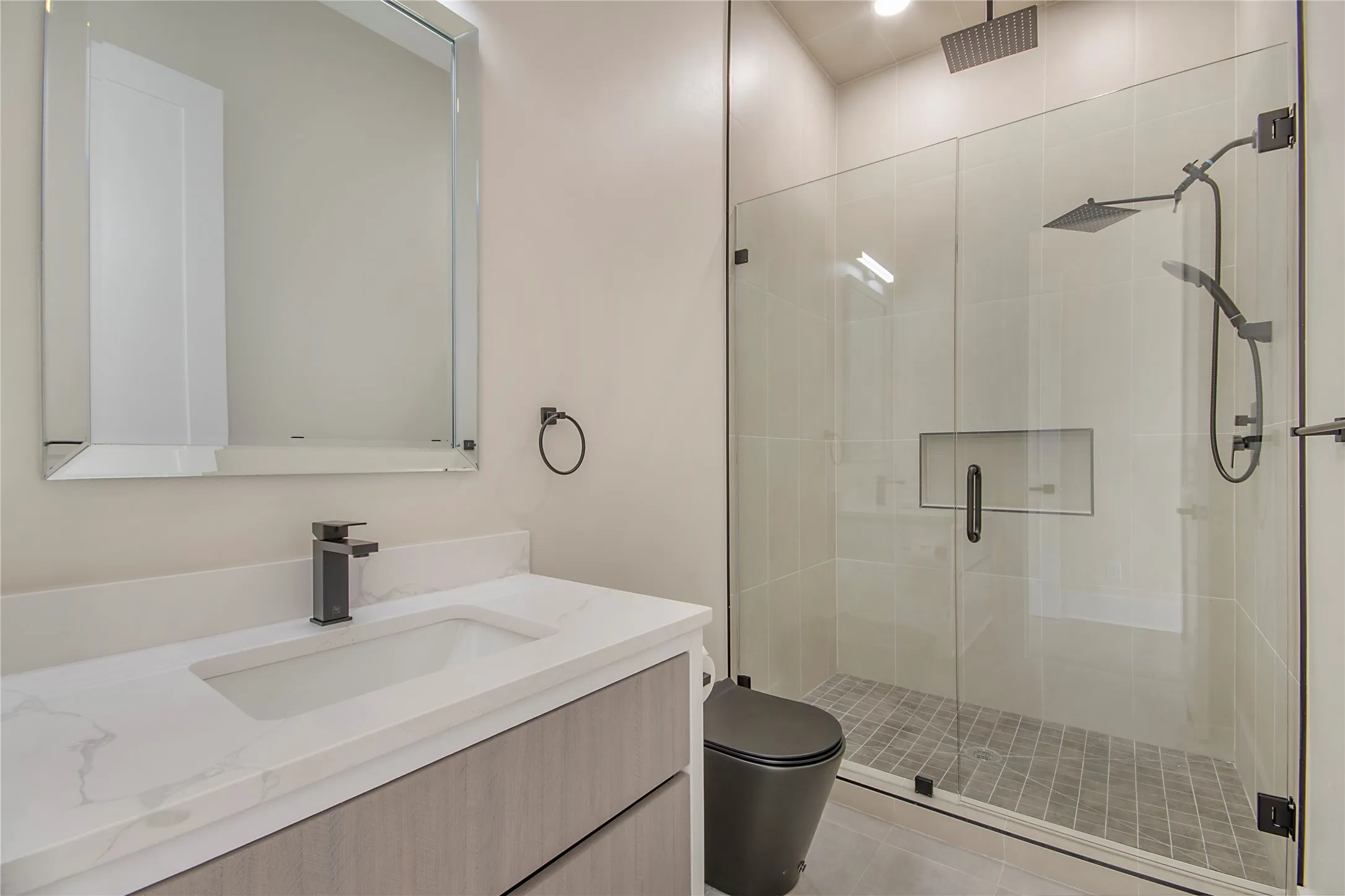 Full bath with a stall shower and vanity