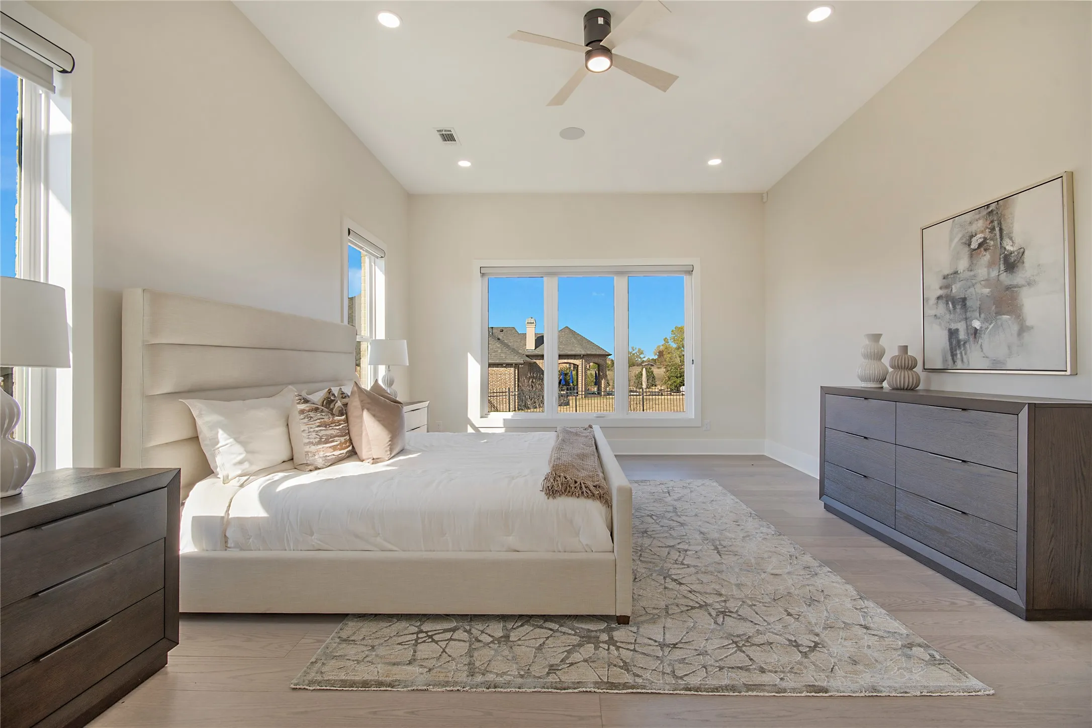 Bedroom featuring ceiling fan, light wood-style flooring, and recessed lighting