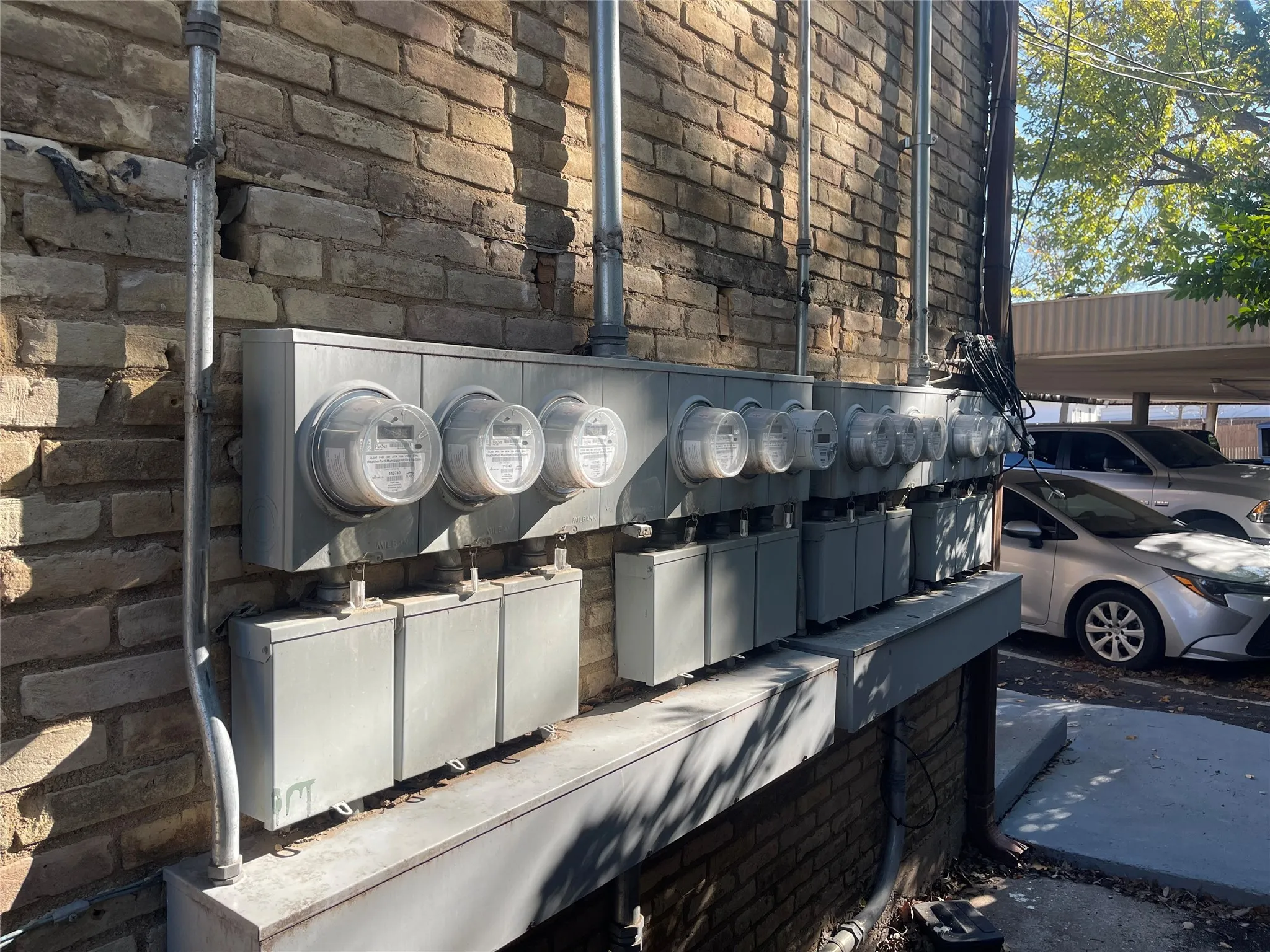 Exterior view of electric meter and stone siding