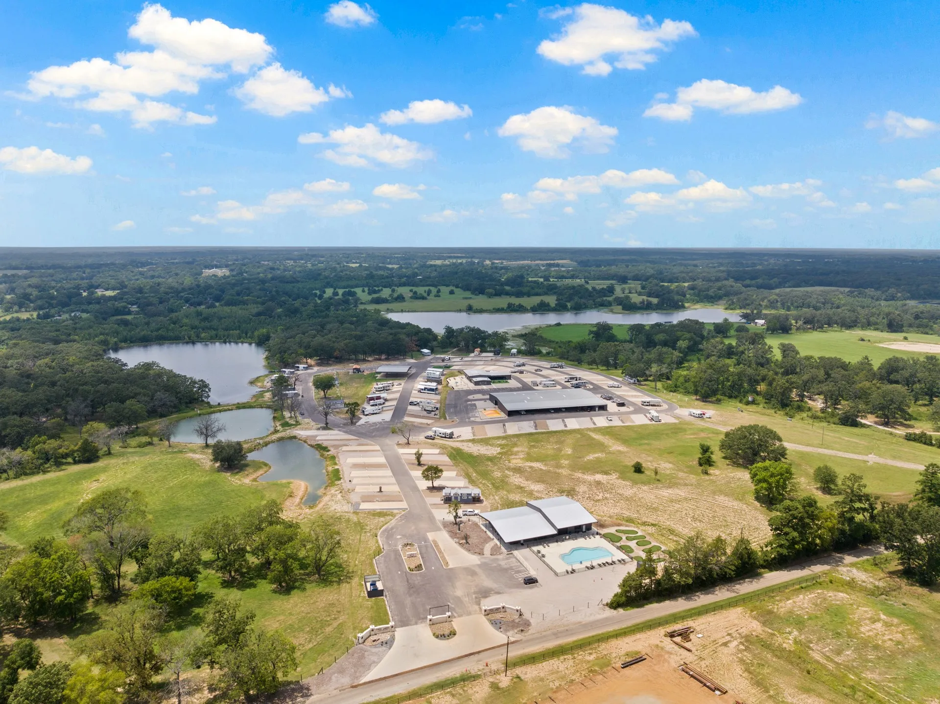 Bird's eye view of a large body of water and a heavily wooded area