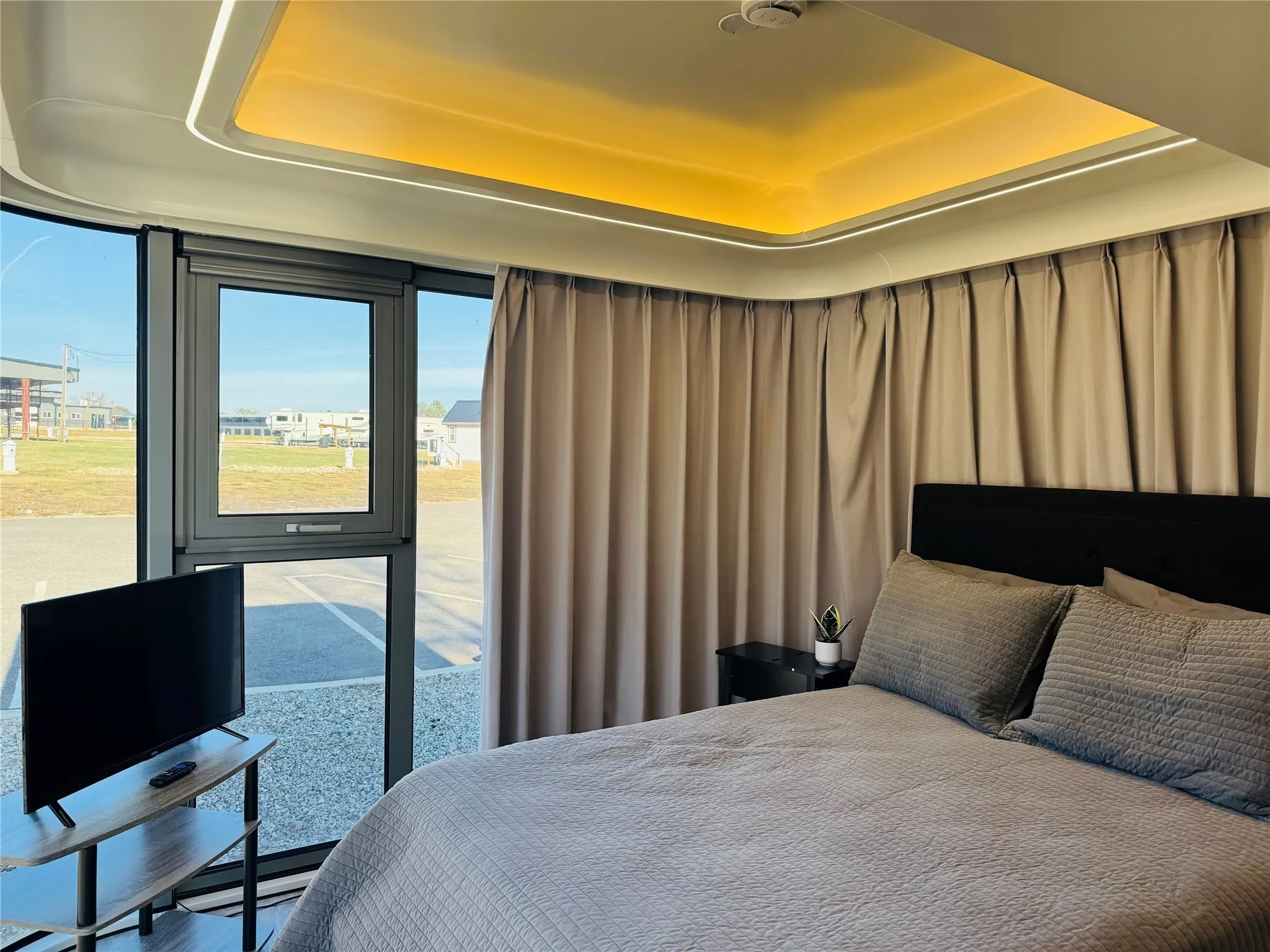 Bedroom with a raised ceiling