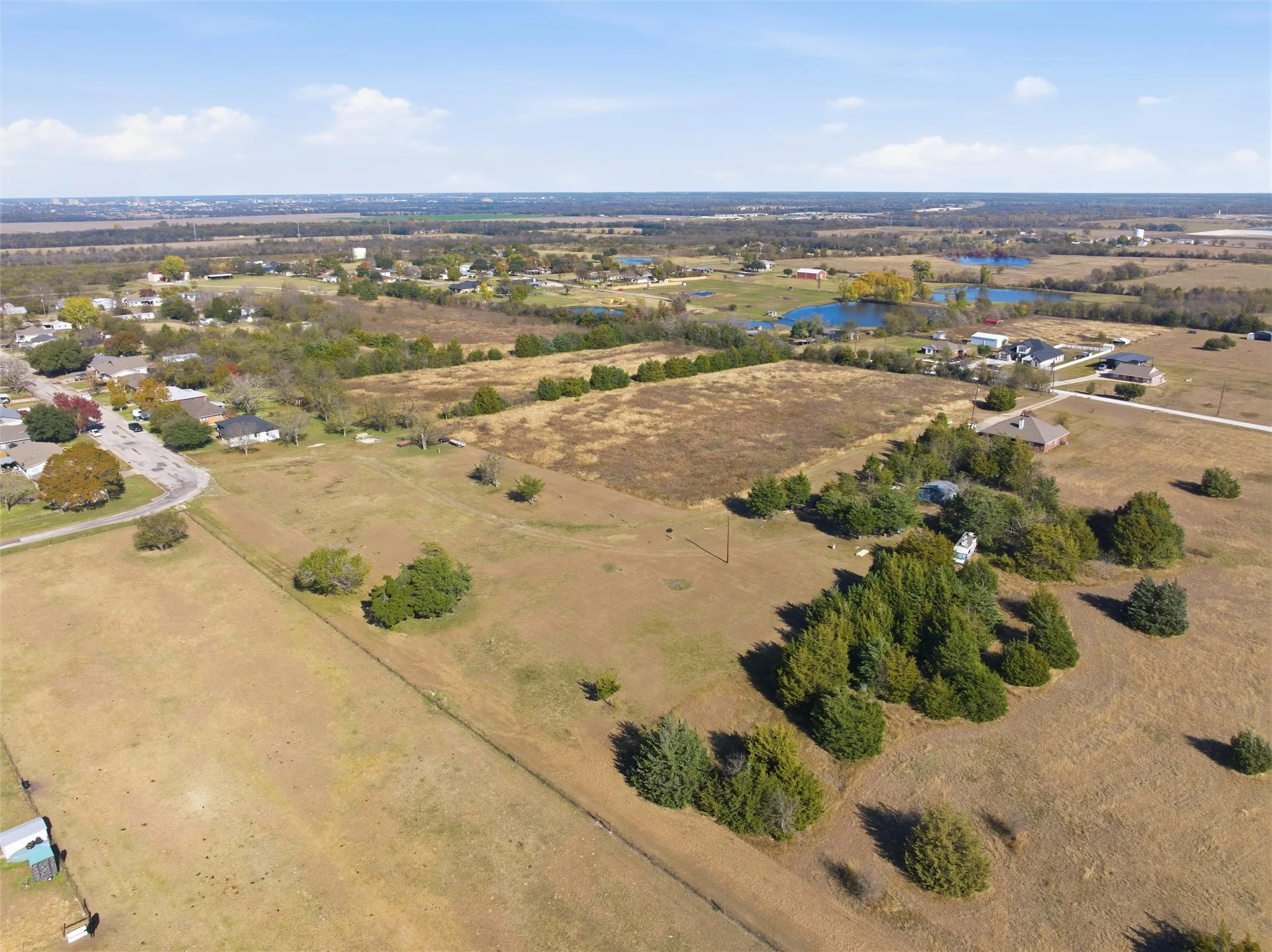 Aerial view of property and surrounding area with rural landscape and a nearby body of water
