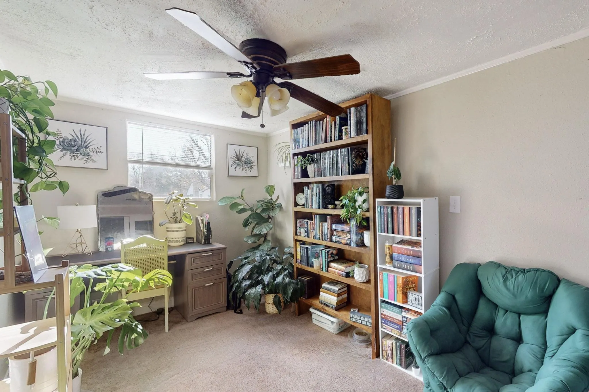 Office area featuring crown molding, a textured ceiling, light colored carpet, and ceiling fan