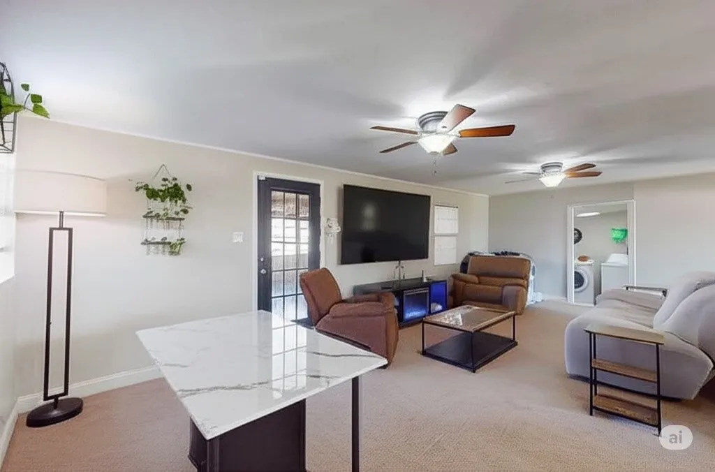 Living room with light colored carpet, washer / dryer, and a ceiling fan