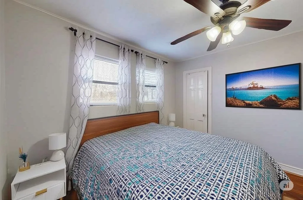 Bedroom featuring crown molding, a ceiling fan, and wood finished floors