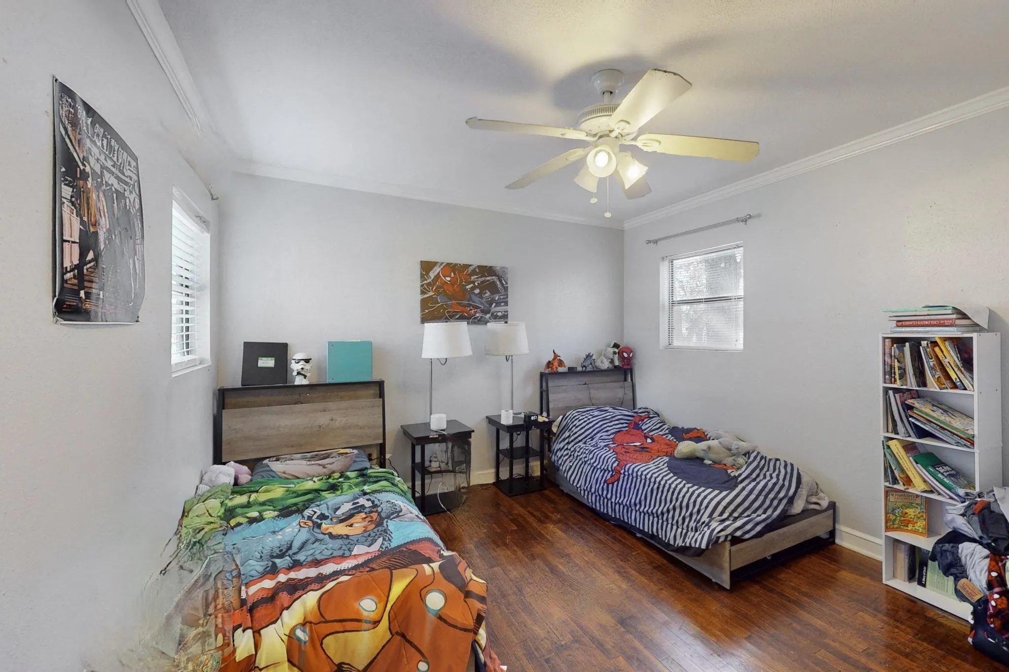 Bedroom featuring ornamental molding, ceiling fan, and dark wood finished floors