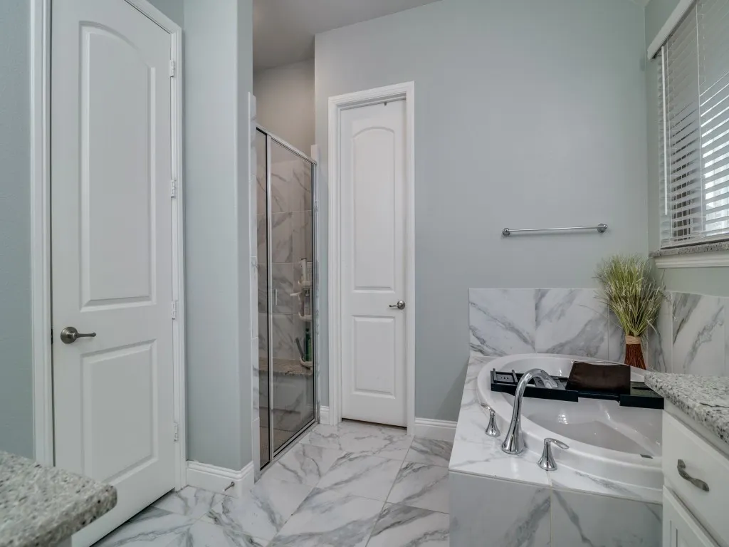 Separate shower and walk-in closet with closet system