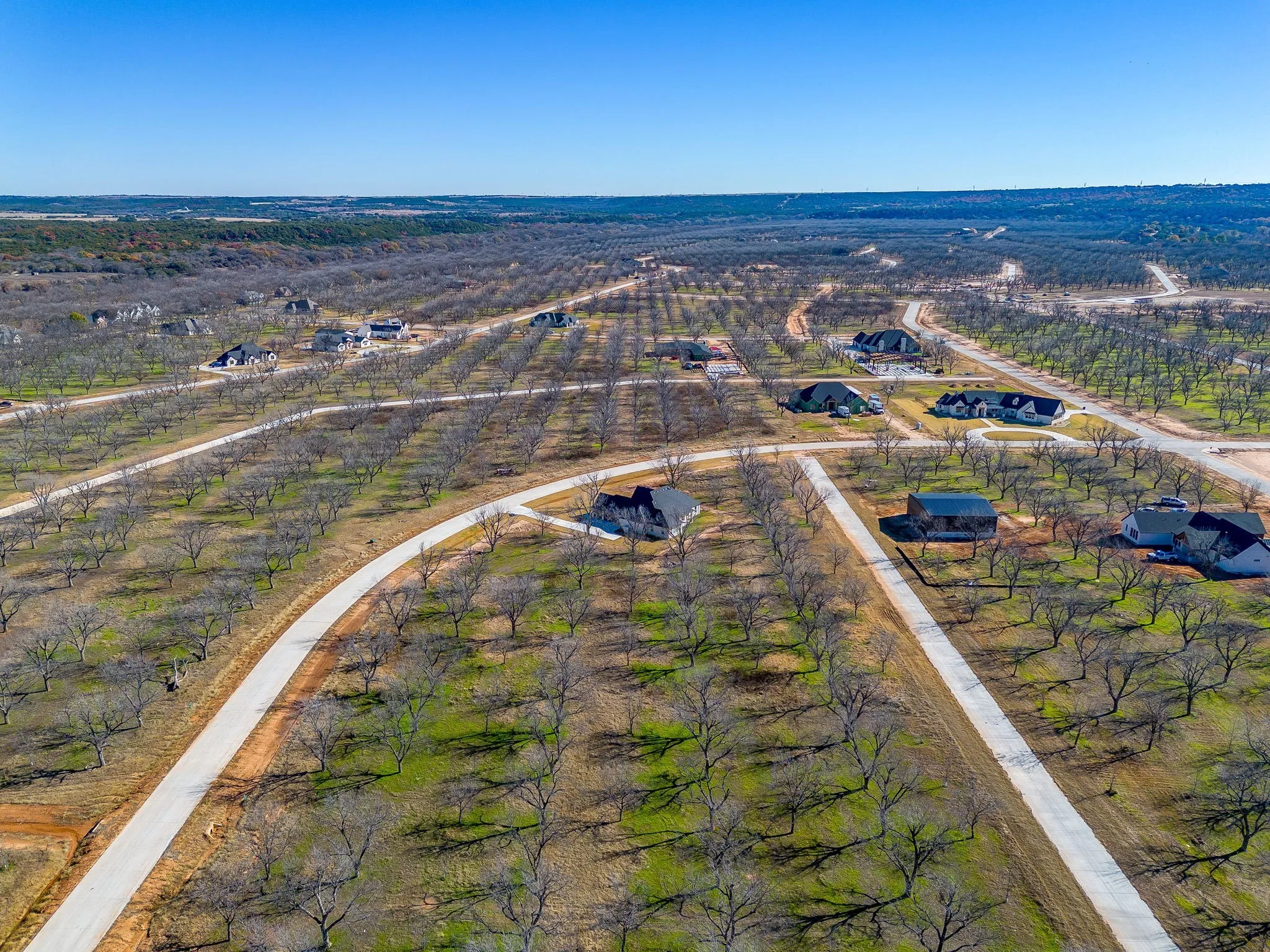 Aerial view of sparsely populated area with farmland