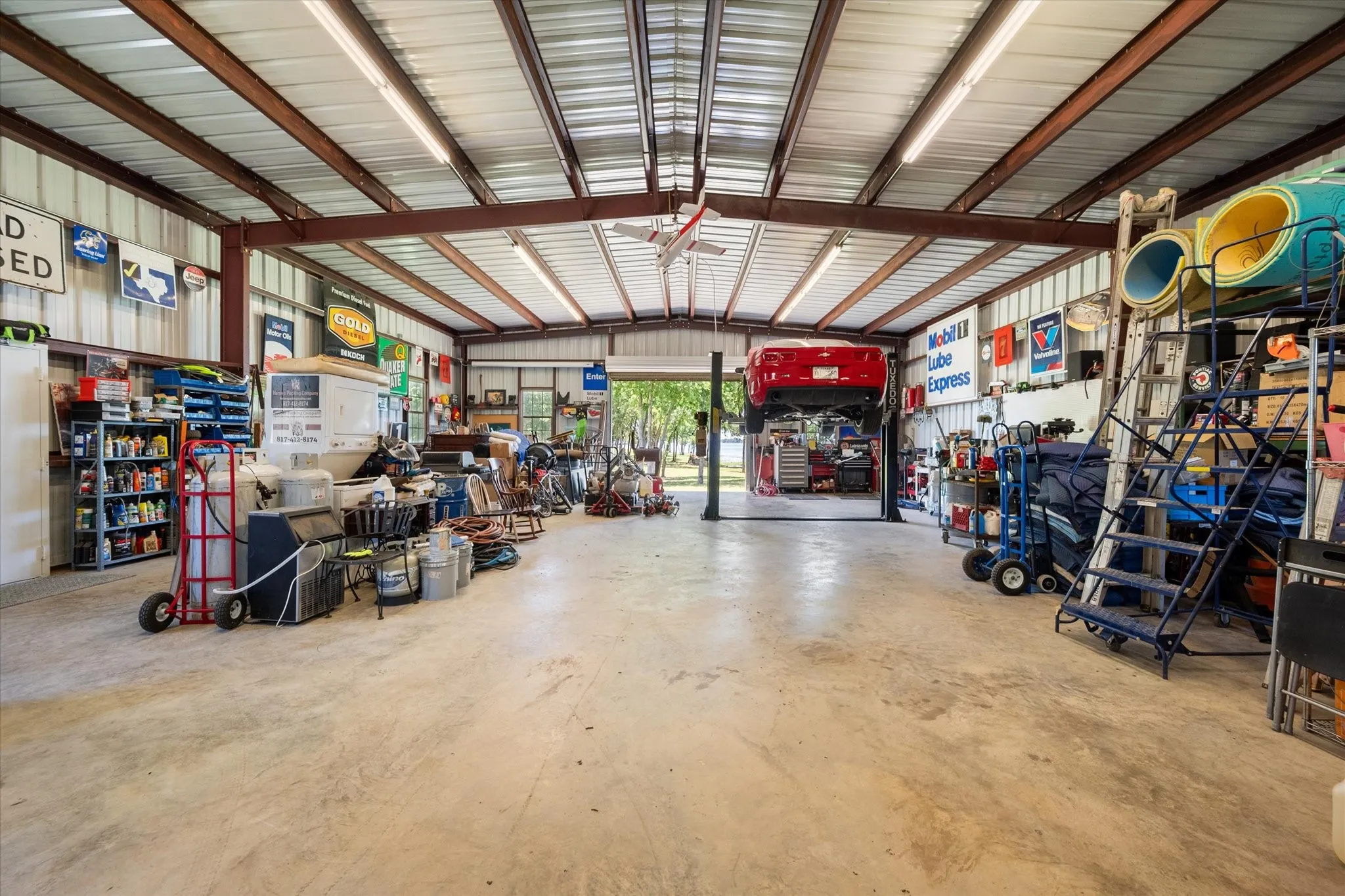 Garage with metal wall and a workshop area