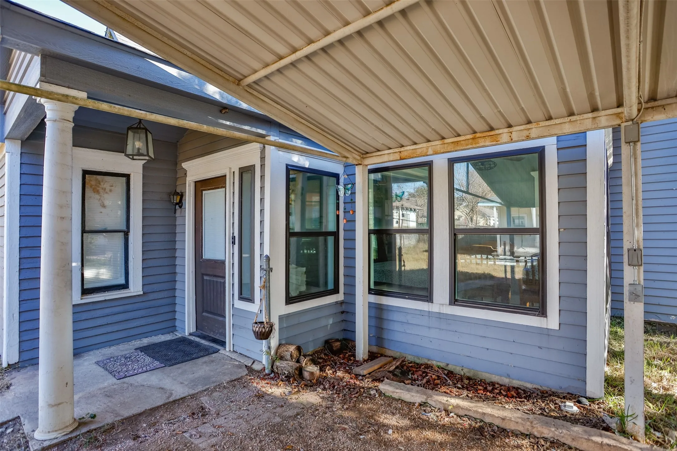 View of exterior entry featuring a patio