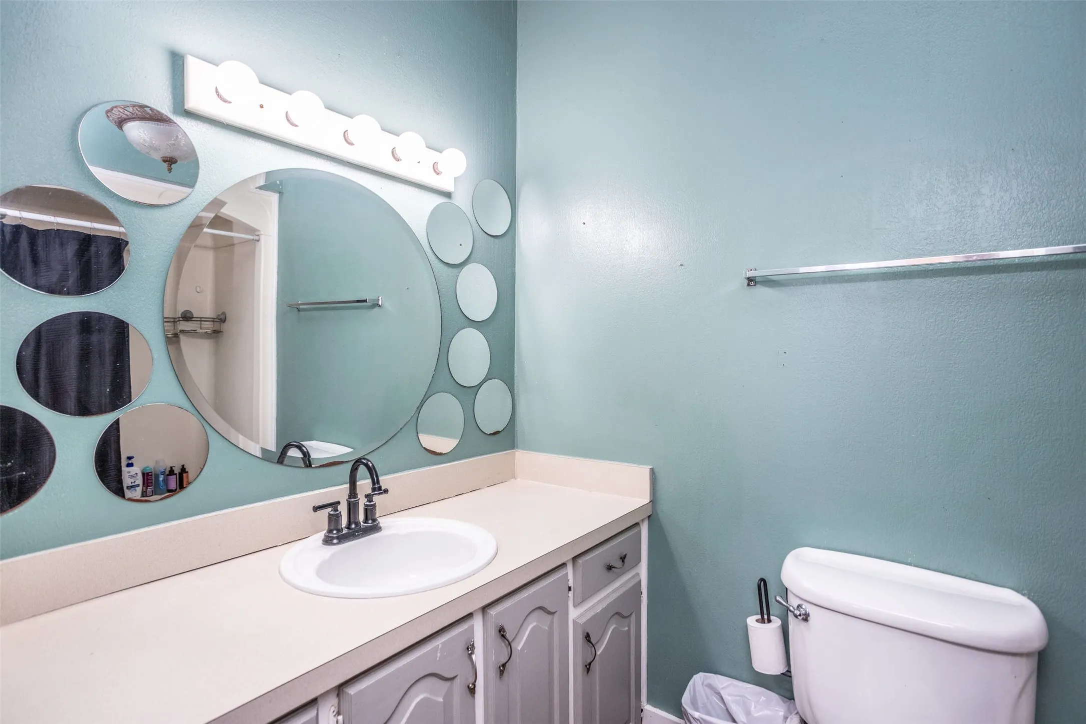 Secondary Bathroom with vanity, shower and toilet