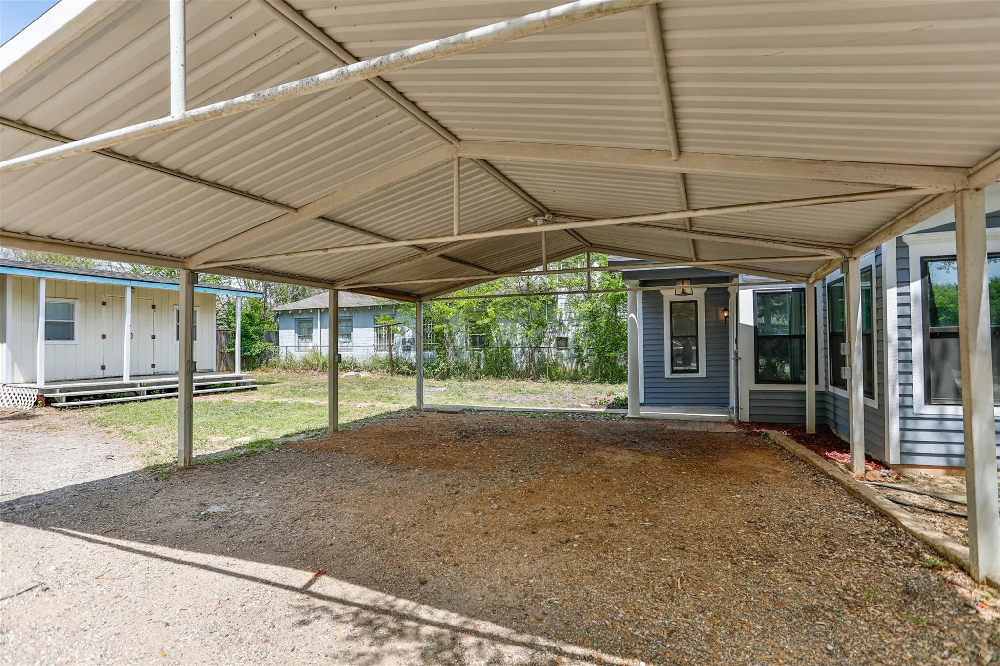 Oversized Carport In Rear Of Home
